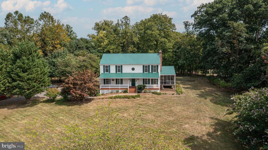 UNDER CONTRACT- SELLER WILL LOOK AT BACK UP OFFERS. THIS HOUSE SPARKLES! Beautifully updated Colonial on picturesque 3-acre lot! NO HOA! Minutes to charming downtown Lovettsville with restaurants, Back Street Brews Coffee and tea shop, Lovettsville Diner, doctors, veterinarians and this fall, the new Lovettsville Coop grocery store. Home is only a 10-minute drive to the MARC TRAIN station in Brunswick for travel into DC five days a week.  Lovely and spacious home offered by the original owners features a fantastic kitchen renovation including a full-sized dining bar, new cabinets, lighting, new tile flooring, quartz countertops and dazzling back splash, and stainless-steel appliances.  Kitchen has spacious walk-in pantry and steps out to bucolic rear yard - ideal spot for gilling. Main level is SO SPACIOUS AND OPEN with two living areas: one that opens to the dining area that opens to the kitchen and the other featuring beamed ceilings and a Jotul stove that opens to the side Screened- in porch. Beautifully renovated Primary Suite and Upper Hall baths make this already fabulous house ready for a new era.  The finished recreation room with walk up double doors features a large recreation room, quest quarters and full bath and a lower snack area with cabinets and counters which set the home up for multi-generational living.  Enjoy the serene setting from the deep and full front porch that overlooks the sweeping lawn and weeping willow tree.  Roof is only 5 years old, new carpet throughout the home, freshly painted, new tile floor in kitchen, Primary and upper hall bath floors. Existing mature landscaping includes booming apple and peach trees, perennial flowers and bushes. Still maintains the Western Loudoun County vibe.  New Lovettsville Community Center and Park are just minutes from the house and are AMAZING!! HURRY TO THIS ONE!