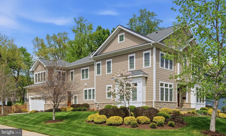 Tucked into a sought-after Vienna neighborhood, this custom-built home offers the rare feeling of quiet privacy—an everyday retreat with room for everyone when it is time to gather. From the moment you step into the marble-floored foyer with tray ceilings, the tone is set with thoughtful craftsmanship, generous scale, and an easy flow that makes both peaceful mornings and lively celebrations feel effortless across three finished levels.

The main level impresses with 10-foot ceilings, rich hardwood floors, and plantation shutters, framing light-filled spaces that strike the perfect balance between intimate comfort and large-scale entertaining. The chef’s kitchen is the heart of the home, featuring an oversized island with ample seating and storage, granite countertops, and premium stainless-steel appliances, including a Kucht 6-burner gas range and double wall ovens. Conversations naturally gather around the kitchen, where meals come to life. A sunny breakfast room opens onto the rear patio, creating a seamless connection between indoor and outdoor dining. The family room, with its coffered ceiling, gas fireplace, and French doors, offers a cozy yet sophisticated space. For more formal occasions, the living and dining rooms, both with tray ceilings, set the stage for elegant holiday hosting, while the butler’s pantry with wine fridge ensures smooth entertaining. The main level also includes a bedroom and a thoughtfully designed mudroom for everyday convenience.

Upstairs, the sense of calm continues with 10-foot ceilings and hardwood floors throughout. The primary suite is a true sanctuary, offering a spacious sitting area, tray ceiling, and gas fireplace—a perfect retreat for unwinding at the end of the day. Step through French doors to your own private balcony for fresh air and quiet moments. A coffee bar with a wine fridge and sink enhances the suite’s charm, ideal for leisurely mornings or a nightcap before bed. Additional bedrooms are designed for modern living, including an au pair/nanny suite or office with an ensuite bath and private staircase, as well as three more generously sized bedrooms (one with an ensuite bath and two connected by a Buddy Bath). A separate laundry room ensures the household runs smoothly.

The lower level is designed with both functionality and fun in mind, offering a space perfect for movie nights, game days, or hosting gatherings that don’t interrupt the flow of the main living areas. With 9-foot ceilings and ceramic tile flooring, the expansive rec room provides ample space for media, dining, and play. A stylish kitchenette with island seating, under-cabinet lighting, a sink, and a wine fridge makes entertaining easy. A bedroom and full bath create a comfortable space for overnight guests, while the wine room—capable of storing over 300 bottles—adds a touch of sophistication. A bonus workout room rounds out this level, ensuring there’s something for everyone.

The spacious patio extends the living space outdoors, ideal for summer meals, milestone celebrations, or simply enjoying the serenity of your surroundings. Conveniently located near shopping, dining, parks, and commuter routes, and just approximately 1 mile from the Vienna Metro Station, this exceptional home offers a perfect blend of peaceful, private living and everyday convenience.