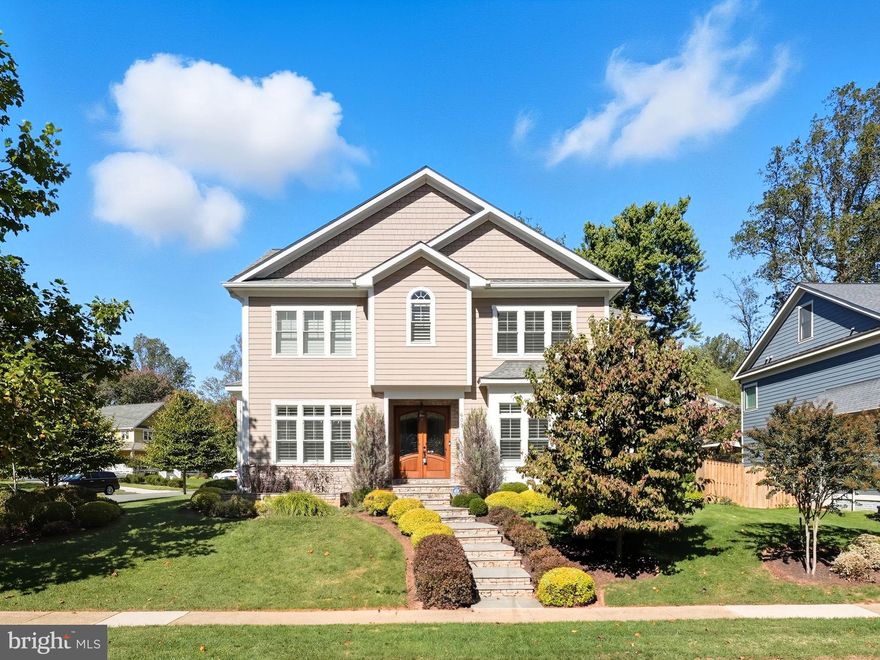 Welcome to this stunning custom-built residence, where timeless elegance meets modern luxury. Designed for both comfort and entertaining, this exquisite home showcases beautifully appointed living space across three finished levels. Main Level: Enter through a grand foyer with marble floors and tray ceilings, setting the tone for the sophistication throughout. Soaring 10’ ceilings, rich hardwood floors, and plantation shutters accent the open, light-filled spaces. The chef’s kitchen is a true showpiece, featuring an oversized center island with seating and storage, granite counters, and stainless steel appliances including a Kucht 6-burner gas range and double wall ovens. A sunny breakfast room opens to the rear patio, while the inviting family room boasts a coffered ceiling, gas fireplace, and French doors leading outside—perfect for indoor-outdoor living. Formal dining and living rooms each feature tray ceilings, with a butler’s pantry and wine fridge adding convenience. A main-level bedroom and a well-designed mudroom complete this level. Upper Level: 10’ ceilings and hardwood floors continue upstairs. The luxurious primary suite offers a grand double-door entry, a spacious sitting area, tray ceiling, and a cozy gas fireplace that adds warmth and charm. French doors open to a private balcony, while a coffee bar with wine fridge and sink adds a touch of indulgence. Additional bedrooms include an au pair/nanny suite or office with ensuite bath and private staircase, plus three more spacious bedrooms (one ensuite and two sharing a Buddy Bath). A separate laundry room adds practicality. Lower Level: Designed for relaxation and recreation, the lower level features 9’ ceilings and ceramic tile flooring. The expansive rec room offers ample space for media, dining, and game areas, complemented by a kitchenette with island seating, under-cabinet lighting, sink, and wine fridge. A bedroom and full bath provide guest accommodations, while a wine room with storage for 300+ bottles and a bonus workout room complete this level. Outside, enjoy a spacious patio ideal for gatherings and quiet moments alike. Located in a sought-after Vienna neighborhood, this exceptional home is close to shops, dining, parks, commuter routes, 1 mile to the Vienna Metro Station —offering refined living in a prime location. Photos may be virtually staged