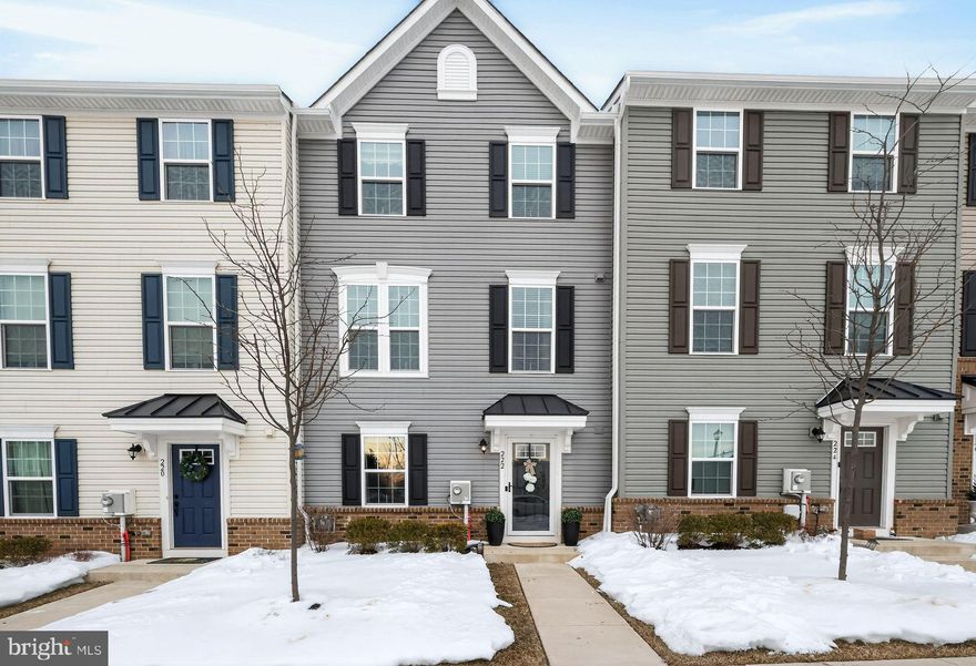 Welcome to 222 Center Drive! Nestled in the charming Dublin Crossing community, this beautiful townhouse offers a blend of traditional elegance and modern convenience. The interior is designed for both comfort and style. As you enter through the front door, you’re greeted by a thoughtfully designed lower level offering flexible living space ideal for a study, exercise or recreational room, and a mud room with extra storage to keep everything organized, and a powder room.  The attached 1-car garage is equipped with built-in shelves and three-tiered shelving, providing exceptional storage solutions and a spacious driveway. The main level showcases an open-concept layout designed for both everyday living and entertaining. The spacious living room flows seamlessly into the expansive kitchen, where a large center island anchors the space and offers additional seating. Gorgeous granite countertops, a stylish tile backsplash, pantry, and generous cabinetry create a kitchen that is both beautiful and functional. An eat-in dining area provides ample space for gatherings, while the electric fireplace adds a warm and inviting focal point to the living area. A conveniently located powder room completes this level, and deck access enhances indoor-outdoor living. Upstairs, the primary suite features a tray ceiling, walk-in closet, and private bath, creating a comfortable retreat. Two additional bedrooms and a full hall bath offer flexibility for family or guests, including a bedroom highlighted by a beautiful accent wall that adds character and charm. A centrally located laundry area provides everyday convenience to complete this level. 
With its thoughtful layout, and abundant storage throughout, this home offers comfort, functionality, and modern style in one of the most desirable floor plans available.  Enjoy a truly walkable lifestyle in Dublin Crossing, ideally situated next to The Square and Dublin Town Center. Stroll to local shops, restaurants, and the post office.  Just minutes from  Doylestown, and with easy access to Routes 313, 611, 202, and 309 for convenient commuting.