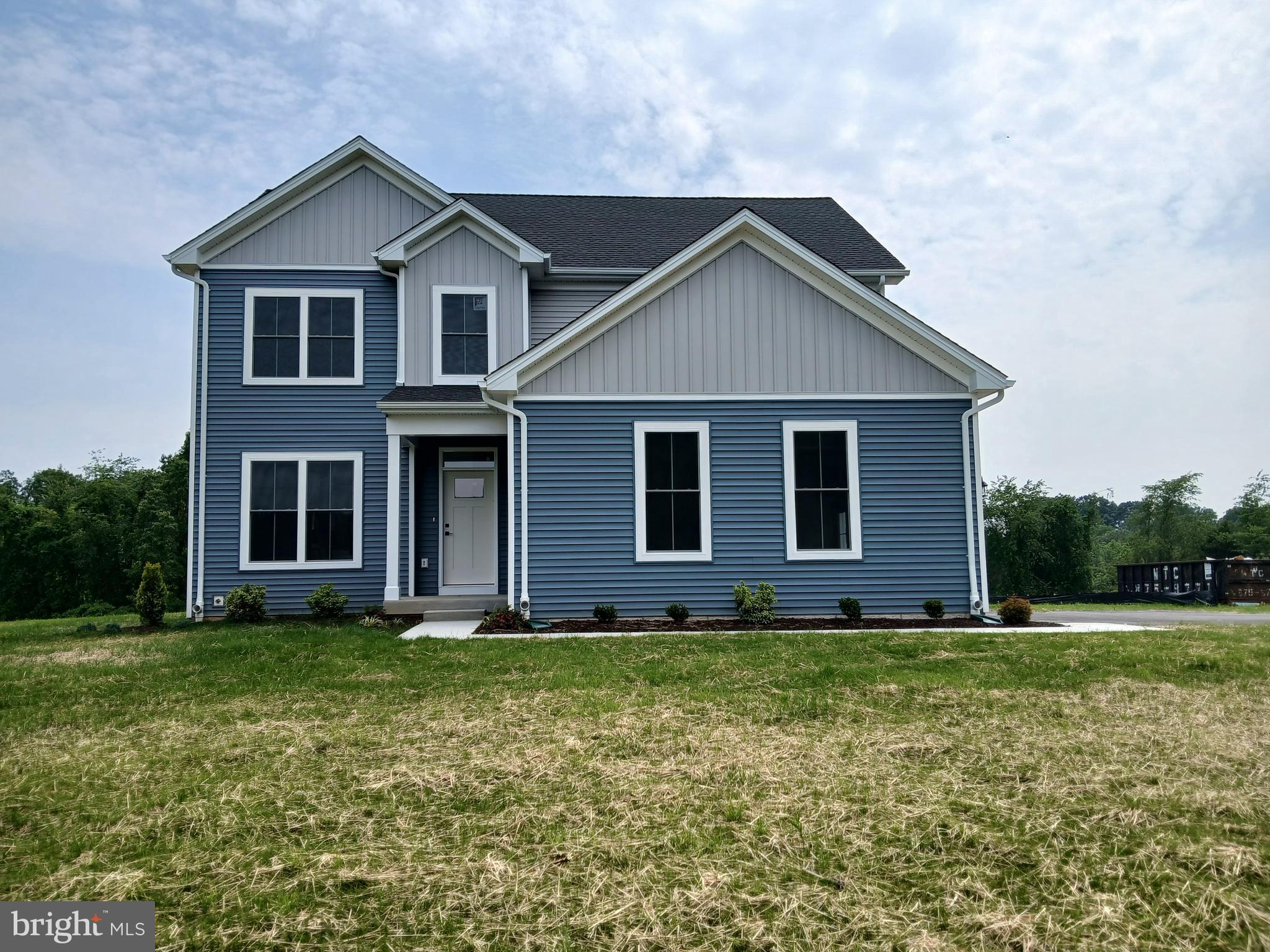 ***Huge $30k Price Drop. Builder says sell this now!***Stunning new construction colonial with over 2,300 square feet of beautifully finished living space and a two-car garage. This 4-bedroom, 4-full-bath home is loaded with upgrades, including luxury vinyl flooring throughout, granite countertops, stainless steel appliances, and oak stairs. The first floor features nine-foot ceilings and a spacious great room with a ceiling fan. Each bedroom includes a ceiling fan and walk-in closet—except bedroom two—and the luxurious primary suite offers cathedral ceilings and a private en-suite bath. The basement includes a fully finished bathroom, while the rest remains unfinished, offering potential for future customization. Additional highlights include second-floor laundry, double-hung windows, dual-zone heat pump HVAC, and professional landscaping. All situated on a picturesque lot. (New Property Taxes are estimated, not exact.)