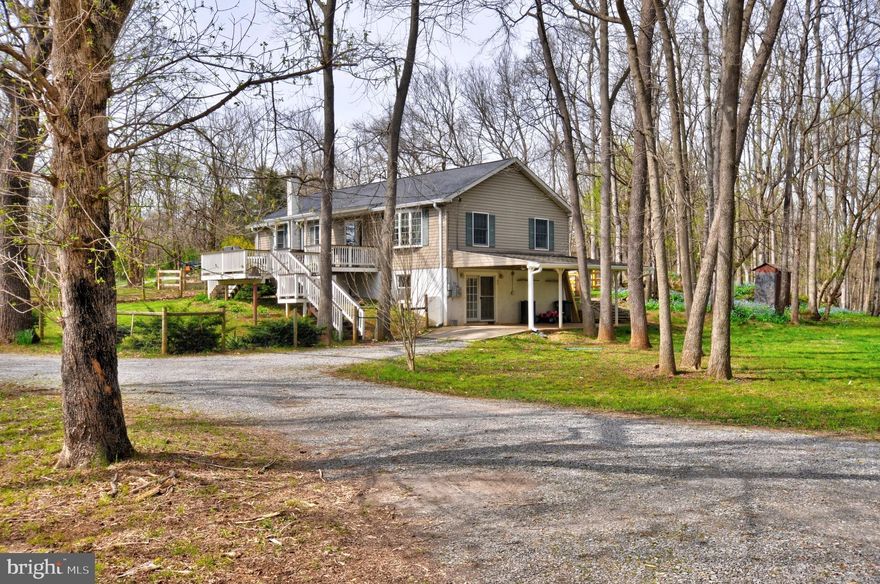 Welcome to Blue Bell Haven...3 bedroom 2 and a half bath Ranch on 2.32 woodland acres   Close to the Shenandoah River with river access just a 5 minute walk from your front door, Can be driven to with 4WD vehicles or ATV's.  Lots of great fishing! Well kept home with 2 covered porches and large decking for those summer cookouts.  Lounge on your rear porch and enjoy the wildlife and gorgeous park like setting.
The  2 secure outbuildings , one has a garage door and electric .
  The 2 car carports and the circular driveway offer plenty of parking.  
All this and only 26 miles to Leesburg.