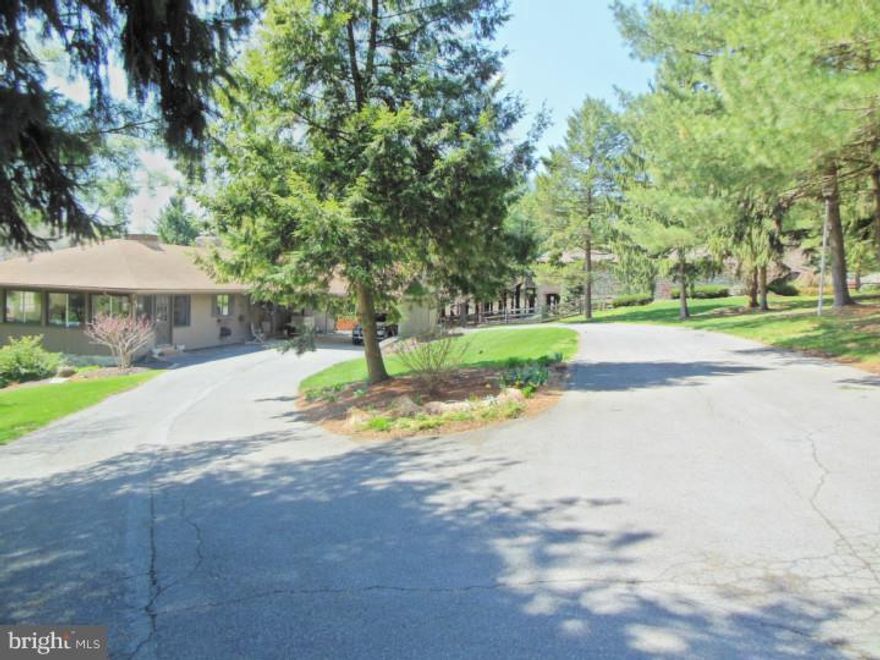 Picturesque is the way to describe this beautiful ranch style home and its surrounding property. The property offers 3 spacious bedrooms all with large windows to allow natural light to filter in. The upstairs was built for entertaining with a large family room with a fireplace and dining room both overlooking a expansive deck with a view of the property. The kitchen offers new appliances, tile backsplash and plenty of countertop space. The sunroom on the side of the house allows you to relax while reading or passing the time. The lower level offers a full walkout design with tons of natural light and a family room with a large brick fireplace. The property has a park like setting which leads into a large pond for fishing or taking an adventure. This home is a must see. SELLER MOTIVATED!
