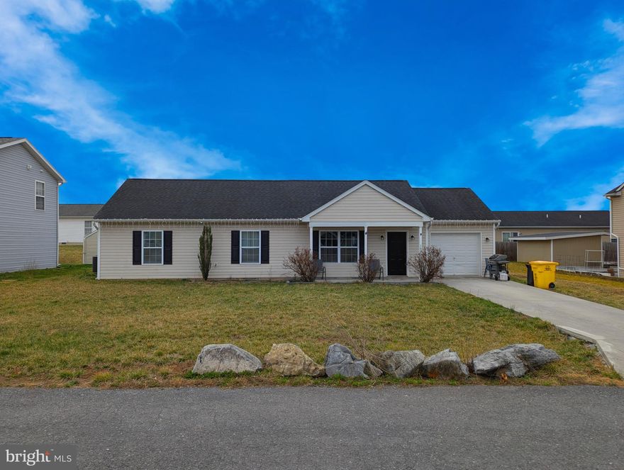 Welcome to 163 Minister Drive in charming Martinsburg, WV! This delightful home offers 3 bedrooms and 2 completely updated full bathrooms, all new carpeting and freshly painted throughout and ready for you. The brand new kitchen boasts beautiful natural cabinets, shiny new appliances, and sleek solid granite countertops. Enjoy your morning coffee on the  covered front porch or turn the backyard into an oasis with sliding door access.  This home is a perfect retreat for relaxed living. Don't miss out!