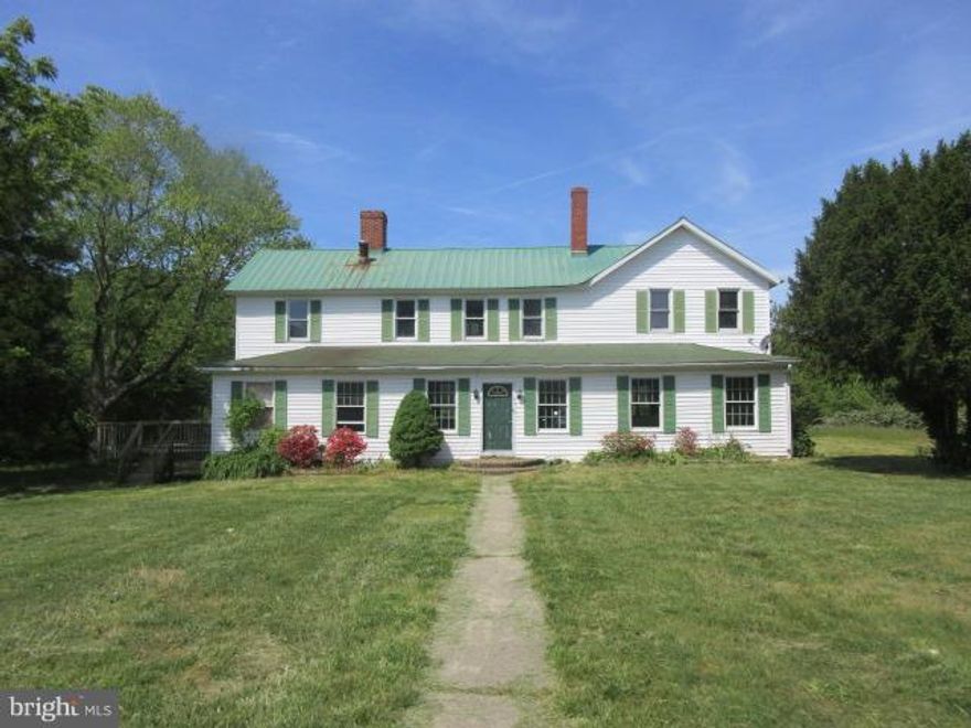 Located in area of Ridge this large farmhouse has lots of potential.  Sited on over 2.8 acres of land and with over 3500 sqft of living space.