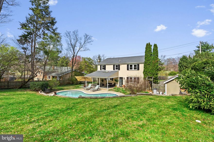 This sun-drenched colonial in the heart of Chestnut Hill is the perfect blend of charm, functionality, and timeless appeal. Nestled far off the road on a lush third of an acre, this property offers your very own private oasis with beautifully and professionally landscaped gardens, a covered back patio, and a stunning heated in-ground plaster pool—ideal for soaking up summer days in one of Philadelphia’s most coveted neighborhoods.

Step inside to discover a thoughtfully designed first floor featuring a welcoming foyer, a cozy living room complete with a grand wood-burning fireplace, a formal dining room, a bright and airy family room, updated powder room and large coat closet with custom shelving. The eat-in kitchen with breakfast room or additional living space, is a true showstopper, boasting white cabinetry, sleek quartz countertops, stainless steel appliances, and a gleaming marble backsplash—all with serene views of the patio and pool. Hardwood floors flow throughout, adding warmth and character to every room.

Upstairs, the expansive primary suite awaits, complete with a beautifully renovated ensuite bathroom and a walk-in closet featuring custom shelving for all your organizational needs. Three additional sun-filled bedrooms, each with generous closet space, offer comfort and versatility. A second full bathroom with a tub ensures plenty of room for everyone to unwind and recharge.

The high-ceilinged basement offers endless possibilities, whether you’re envisioning a home gym, playroom, or extra storage.

Location is everything, and this home delivers. Enjoy the tranquility of a private setting while being just a short walk to the top of the hill, where Chestnut Hill’s vibrant community awaits. From boutique shops and restaurants to convenient access to public transit (SEPTA and Amtrak) and the natural beauty of the Wissahickon trails, everything you need is within reach.

With new HVAC, windows, a pool pump, whole house generator and more, this classic home is perfectly suited for modern living. Don’t miss your chance to call 8720 Stenton Avenue home—where you’ll be lounging by the pool and making memories for years to come!