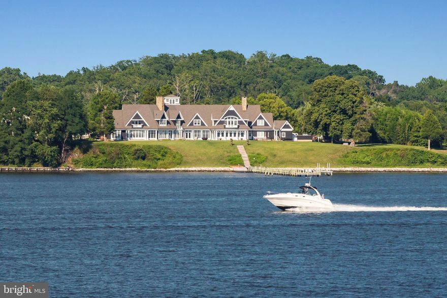 Sited on 1.7 acres on prestigious Melvin Point with incredible water views and 360 ft of water frontage and southwest exposure, pier, heated pool, tree house, 2 outdoor showers & fire pit for year-round retreat living. Living space maximizes expansive sightlines; sleek custom cabinetry, wet bar, main level master suite &  motor court. Appraisers: Call LA for details.