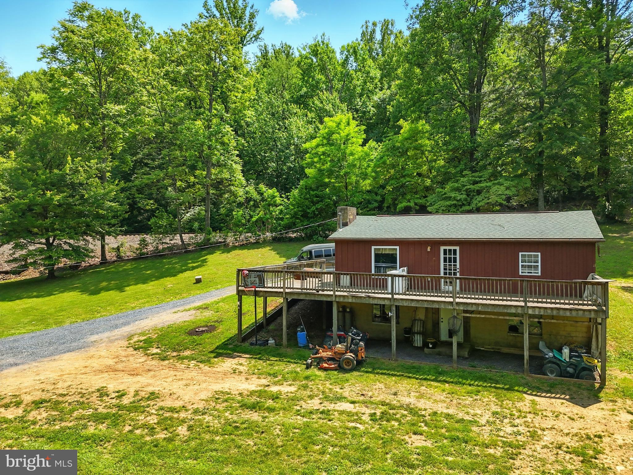 Discover the potential of 13057 John Marshall Highway! The home sits on just over 11 acres in beautiful Fauquier County. The home itself offers 1 bedroom with a large walk-in closet and 1 full bathroom. Its open-concept floor plan allows for seamless transition between the kitchen and living room. The unfinished basement allows for the possibility of extra living space. Enjoy your morning coffee on the expansive deck that overlooks 1 of the 2 ponds on this property! Take a walk outside to explore Goose Creek which runs through the back of the property. There is an additional building that would make a great studio or mother-in-law suite. The possibilities are truly endless! Commuting is a breeze with easy access to 66, and just minutes from Front Royal. Whether you're looking for a second home, investment property, or a home you can put your personal touch on, you won't want to miss your opportunity with this one!
This home is being sold As-Is