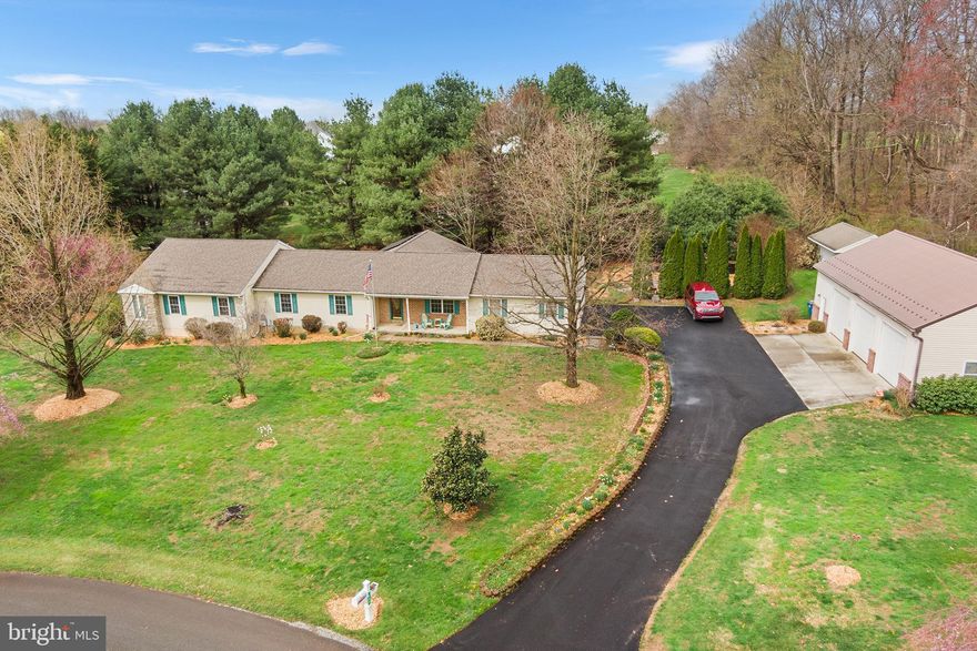 Nestled on a beautiful 1.2 Acre lot you will find 402 Dalton Road in Oxford which offers much more than the eye can see! This spacious 4 bedroom, 4.5 bath home with more than 3,000 square feet of living space has been expanded and updated to offer a great floor plan to meet today’s busy lifestyle. The main level consists of a flex room at the entrance which opens to a beautiful new kitchen with custom cabinetry,  recessed lighting, stainless steel appliances, a pantry and stunning  hardwood flooring. The kitchen flows seamlessly to the Great Room with vaulted ceilings which can be used for dining and family room space keeping everyone connected! Large windows allow an abundance of natural light to flow into the home, plus sliding doors open to a deck which overlooks the private side yard, patio as well as the Koi Pond! Continuing through the home you will find three generous sized bedrooms, two of which have ensuite bathrooms. There is also a full bathroom in the hall. At the end of the hallway is an oversized Owner’s Suite with vaulted ceilings and an ensuite bathroom featuring a heated jacuzzi tub, double sinks, separate shower.  Sliding doors from this room open to a small, private deck which overlooks the outdoor landscape. A half bath, office/bonus room, and access to the attached two-car garage complete the main level.  Need more space, no problem, the large unfinished lower-level holds many options for additional storage or potential living space.  If you are a mechanic or car enthusiast, then you will consider the detached 2 story,  three-bay garage/workshop with hydraulic lift stations a dream! There is also an oversized shed separate from the workshop, which is perfect for stowing all your other equipment. Leaf filters are installed all around the house and shop for added convenience! Thinking about energy savings? This home has solar panels which will help to reduce your electric bills, and a generator should the power go out. This home has it all! Located just minutes away from the local hardware store as well as shopping, restaurants and Lincoln University. Just a short drive to connect to Route 1 for easy commuting North or South. This is a one-of-a-kind property…possibly the one for which you have been searching! Book your appointment today.