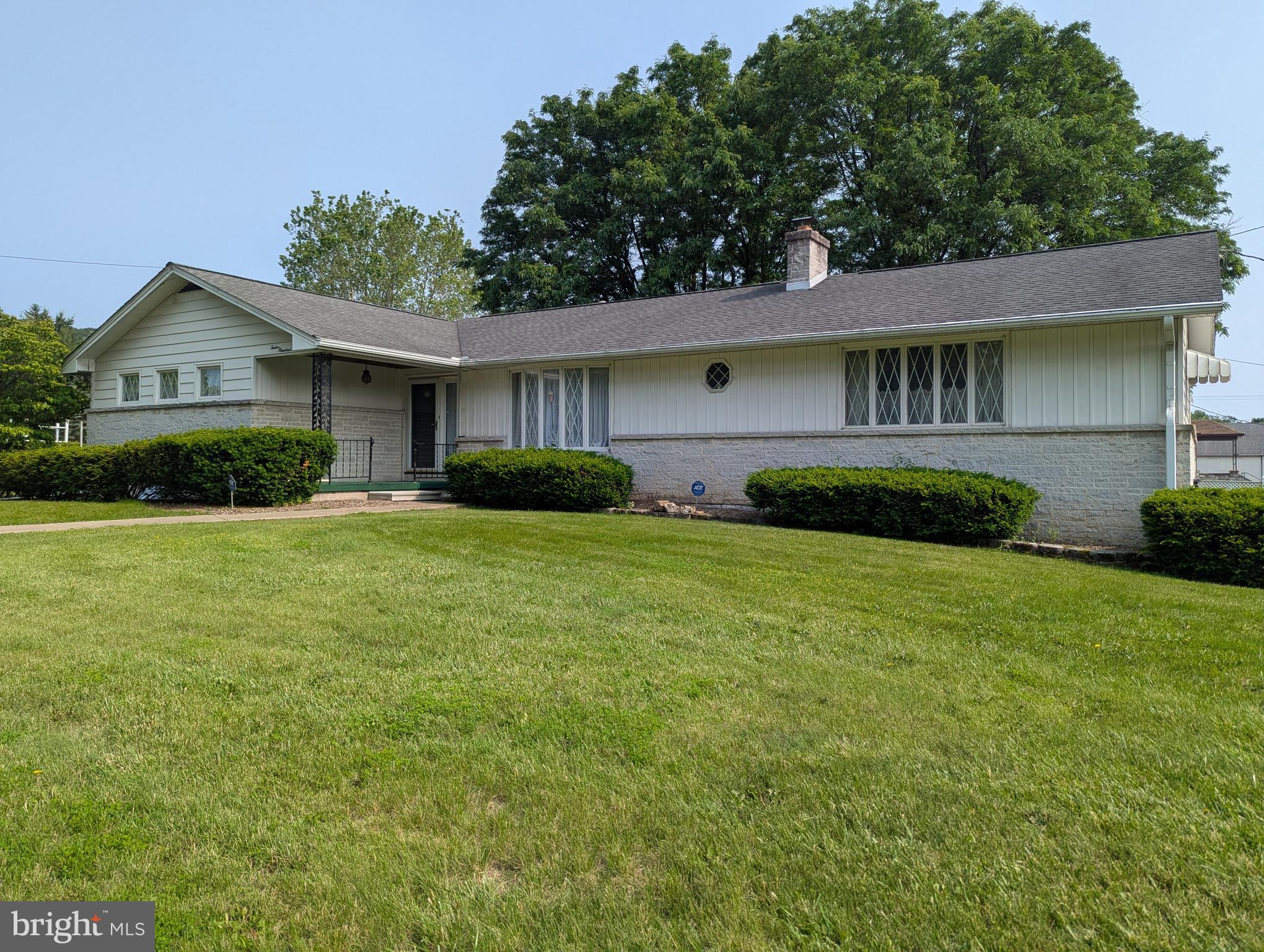 Beautiful white split stone rancher on a level corner lot. Vinyl fencing around the 0.56 A lot. In ground pool with new liner 2024. Beautiful hardwood floors. Two patios, one is covered. Full bath in basement. Brand new carpet and paint throughout the house. 2 car garage. Security system.