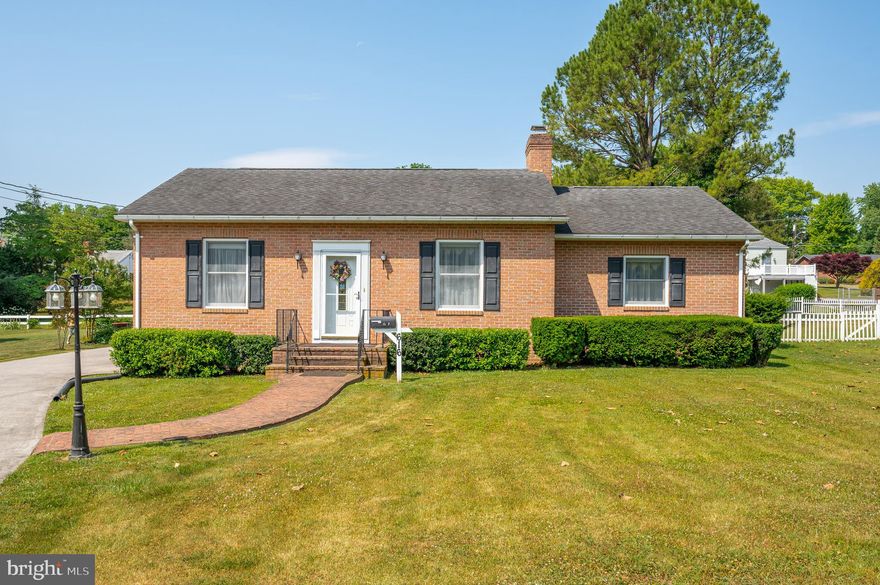 Amazing opportunity to own this gorgeous total brick home located near the Jefferson Memorial Park in Charles Town, WV .   Walking distance to downtown, the neighborhood pool, tennis courts, kids' playground, restaurants, farmers market and close proximity to the Hollwood Casino.   You will enter into a beautiful living room with hardwood floors and gas fireplace with an adjourning sitting room/study. There are two large bedrooms with walk in closets and full bathroom attached in each (no hardwood under carpet).   The dining room has a built-in china cabinet and hardwood floors.  The kitchen has newer appliances with an attached oversize laundry room w/cabinets.   There is an unfinished basement, two car garage with concrete driveway.  (Heat pump is one year old and home has 9 ft. ceilings) Location! Location! Schedule your showing today!