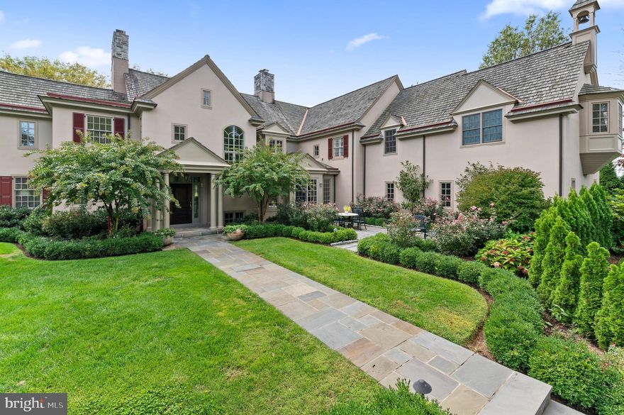 Welcome to Omnia Vincit Amor, the home that love built. Meticulously cared for by the original owners since 1999, this home was designed by architect Peter Batchelor and built by Gary Fisher of Diamond Construction. Upon arrival, you will be greeted by rose bushes and boxwoods as you enter this gated home sitting on over 4 pristine acres. A mature tree line provides you immediate privacy, and you will enjoy over 17 species of trees. On your way up the driveway, you will pass a fenced-in apple grove. Landscape designer Ken Liske meticulously placed every plant and tree to create this oasis. The side and back patio perennial gardens provide beautiful views as the seasons change.
This home offers six bedrooms, four full baths, three powder rooms and four gas burning fireplaces. An abundance of lighting fixtures are antiques and chosen by Vintage Home Lighting. Attention was paid to every detail with double crown moulding, chair rails and picture moldings, hardwood floors and cherry cabinetry throughout. You will appreciate the details as you enjoy views to the back property as soon as you enter the front door. A wide open foyer welcomes you into the warmth of the formal living room which is fashioned with a wet bar. Enjoy the comfortable study nearby and walk down the hallway to the lovely formal dining room which is home to a stunning, French porcelain chandelier and can be made completely private with sliding glass doors.   
The spacious kitchen with lovely fireplace provides ample room for a family dinner. Granite countertops and limestone floor make the personally commissioned wood island top feel right at home. A Bosch double oven, Wolf range top and oven, two Sub Zero refrigerators and two Bosch dishwashers provide ample means to hold large parties or intimate dinners. The butler’s pantry situated off of the dining room will come in handy when entertaining as well.
If it’s a casual meal or movie night in the plans, you can enjoy the breakfast room or TV room right off of the kitchen. You may even want to rest in the windowed porch off of the TV room. No matter where you choose, you will have sweeping views of the property from the many oversized windows.
The pantry in the back hall holds lovely cabinetry and shelving, and leads you toward the three car garage, finished with crown moulding, built-in cabinets and painted floors. 
Ascend the staircase and through the double doors into the primary suite’s sitting area. Beyond sits the bedroom, boasting plush carpeting, vaulted ceilings, and sliding glass doors leading to a private balcony. The spa-inspired ensuite bathroom features a jacuzzi tub, stall shower, dual vanities, and spacious dual walk-in closets. Five additional bedrooms can be found on this level, each with ample closet space. One Ensuite bedroom with private bathroom offers a stunning claw foot tub, while bedrooms 3 and 4 and bedrooms 5 and 6 each share a walk-through bathroom. An additional seating area with built-ins can be found  in the oversized hallway - perfect for lounging or studying. This level is complete with a convenient laundry room with cabinetry. The fully finished lower level is an entertainer’s dream! Detailed with an English style pub, wood-burning fireplace, wine cellar, game area, powder room, and seating area, this basement is ready to host your next party. Located in the heart of Radnor Hunt and within top ranked Great Valley Schools, 335 Boot Rd is minutes to all major roadways for an easy commute and close to many top ranked private schools. This property has it all and is truly magnificent; call for more information today!