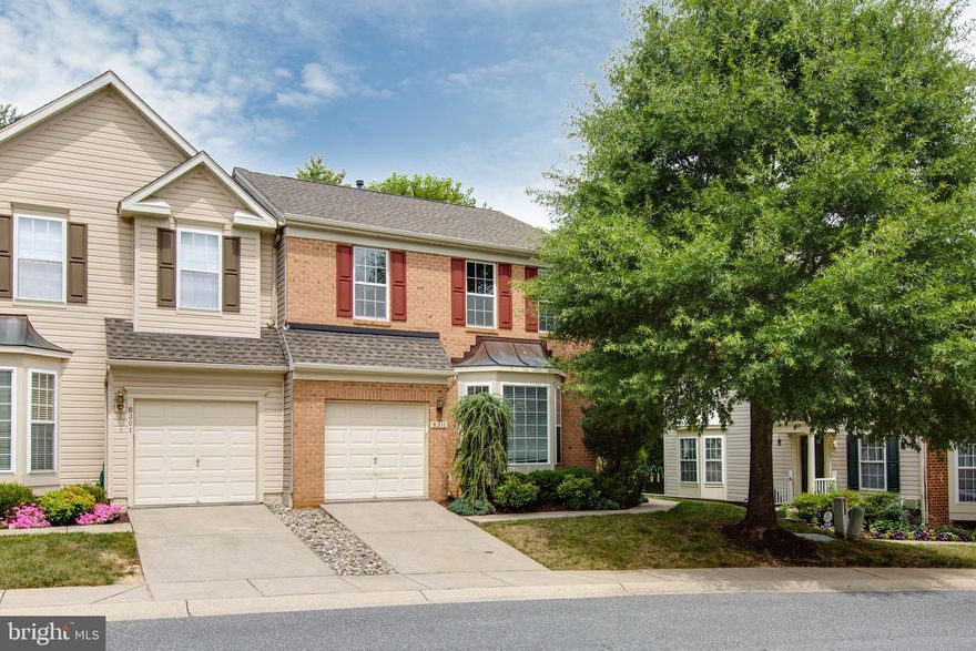 Beautiful End-Unit Villa-Style Townhome in Prime Ellicott City Location! Welcome to this spacious and sun-filled 3-bedroom, 2 full and 2 half bathroom end-unit townhome, perfectly situated in a highly desirable Ellicott City community. The main level features gleaming hardwood floors, high ceilings, and an open-concept layout that flows effortlessly from room to room—ideal for both daily living and entertaining. The eat-in kitchen offers a center island and space for a dining table, perfect for family meals or casual gatherings. Upstairs, you’ll find three generous bedrooms, including a luxurious primary suite complete with a soaking tub, separate shower, and walk-in closet. The finished lower level provides a versatile recreation room with a bonus area, perfect for a home office, gym, or playroom. Step outside to a beautifully designed hardscaped patio, ideal for enjoying outdoor dining  Freshly painted throughout and meticulously maintained.