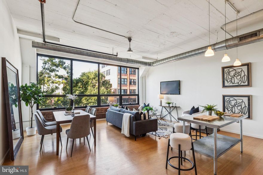 One-Car Parking & Storage Locker Included | Prime Fishtown Loft Living | Freshly Painted & Staged 

Welcome to Unit 211 at Memphis Flats — a bright and stylish south-facing one-bedroom, one-bath loft that perfectly blends modern convenience with authentic industrial character.

This expansive condo showcases soaring 12-foot concrete ceilings, exposed brick, bamboo flooring, and oversized factory-style windows that drench the space in natural light. The open kitchen features stainless steel appliances, sleek cabinetry, and plenty of counter space. A Bosch washer/dryer is tucked into a separate laundry closet, and thoughtful storage is found throughout.

Included in the sale are one reserved off-street parking space and a private 3'6" x 8' storage unit — true city luxuries.

At Memphis Flats, enjoy boutique amenities such as a newly renovated fitness center, secure bike storage, and a stylish resident lounge. Step outside and you’re instantly immersed in Fishtown’s vibrant energy of cafes, boutiques, and acclaimed nightlife.

This is loft living at its finest — spacious, convenient, and unmistakably cool.