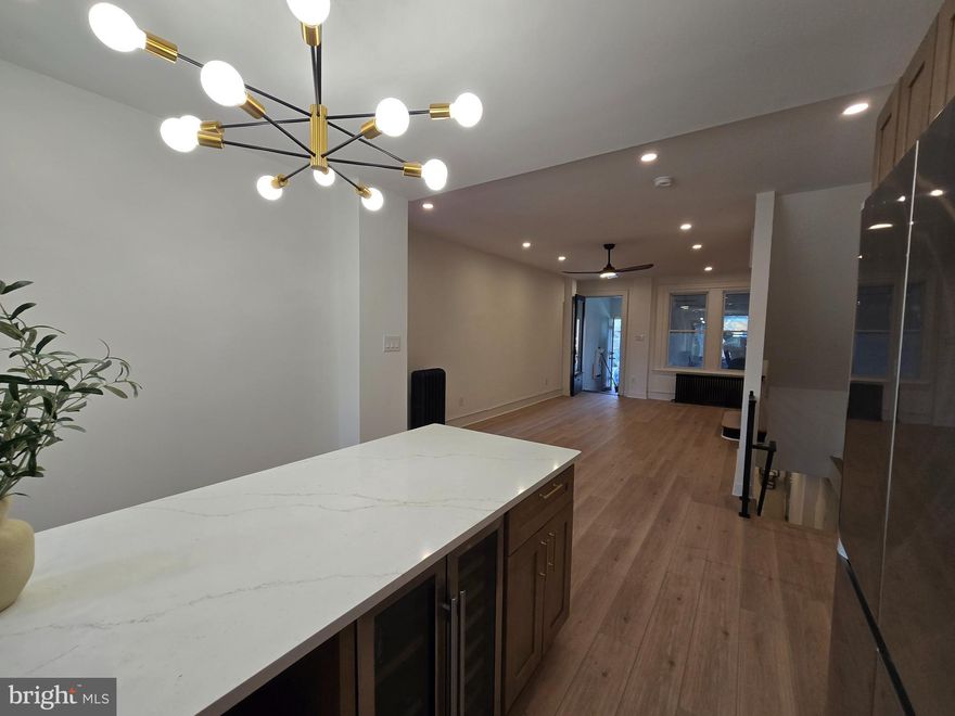 A quiet statement in modern living.

There’s a difference between renovated… and reimagined.
6118 Walton Avenue lives in that difference.

Every system—mechanical, electrical, plumbing—has been rebuilt with intention, creating a home that doesn’t just look new, but lives effortlessly.

The kitchen anchors the space with quiet confidence.
Premium Samsung appliances. Integrated wine cooler. Clean lines that invite both movement and pause. It’s a place designed not just for cooking—but for gathering, lingering, and living fully.

Beyond it, the home opens outward.
An extended deck stretches into a fully fenced yard—private, grounded, ready for both slow mornings and full evenings.

At the front, a heated enclosed porch with its own closet offers something rare: a space that adapts. Studio, reading room, office, exhale.

Downstairs, the finished lower level brings depth to the home—fireplace warmth, a full shower bath, a dedicated laundry room, and a walk-out connection back to the yard.
Layered living. Thoughtfully done.

And throughout it all—details that matter.
Tankless hot water. Seamless flow. Spaces that feel considered.

This isn’t just square footage.
It’s a shift in how a home holds you. 

Schedule your appointment today.