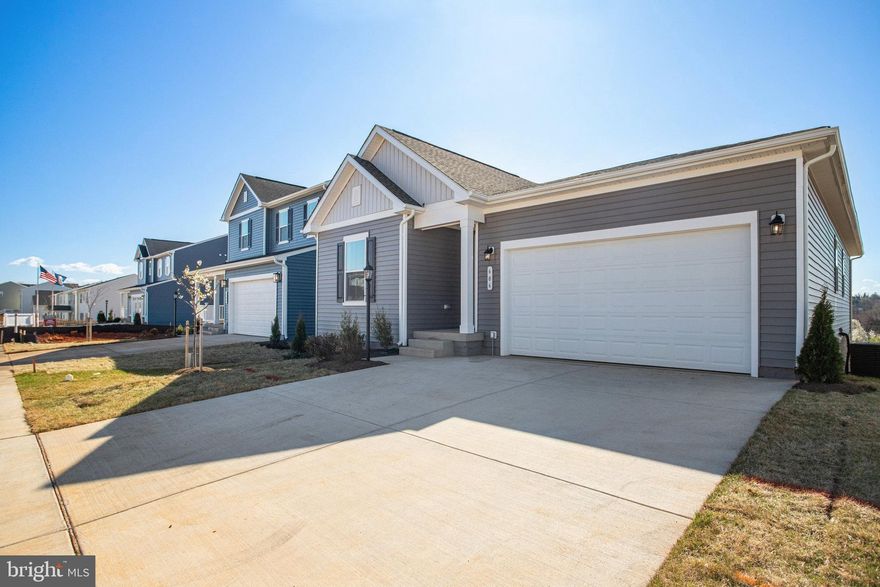 ASK ABOUT SPECIAL FINANCING! $0 down payment USDA financing eligible! This Alexandrite by Richmond American is move-in ready!! Experience the best of single level living in this Alexandrite plan offering many spacious living areas. A covered entry leads past a laundry into an open floor plan, featuring a kitchen with a center island, a dining area, and a great room complete with center meet sliding glass doors and a cozy electric fireplace. The primary suite is adjacent and includes a walk-in closet and private bathroom. You'll find two additional bedrooms and a full bath. The unfinished basement offers plenty of storage space, with room to grow. This home also includes a 2-car garage! Designer curated finishes round out this home, such as quartz countertops, 7 inch LVP in the pubic areas, and sleek matte black light and plumbing fixtures. Welcome to Round Hill Meadows in Orange! Residents will appreciate the small-town charm as well as the conveniences of being close to routes 15, 522 and 3, award-winning wineries, Lake Anna State Park, Lake Orange and the Rapidan River nearby for fishing, swimming, kayaking and boating! Model is OPEN but visitors are encouraged to call ahead to be guaranteed a dedicated appointment.