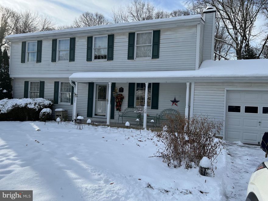 wonderful Severna Park Colonial featuring a finished lower level with walk up stairs den/office and half bath with workshop area and rec room.  New carpeting and hardwood flooring , move in condition