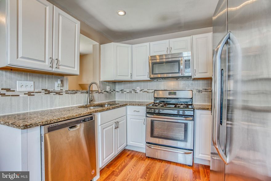 Updated Cape Cod in Murray Point  offers 3 bedrooms, 2 full baths,  gleaming  wood floors on main level, formal dining-room, trey ceilings & crown molding. Kitchen w/ white cabinets, granite counters, tiled back-splash & ss appliances. Spacious Main level owner's suite & updated full bath.   2 additional bedrooms w/ built-in storage on upper level.  Fully finished lower level fam/rec room w/ full bath and laundry.  Enjoy the large level fenced in rear yard, just in time for summer. New windows w/ transferable warranty.