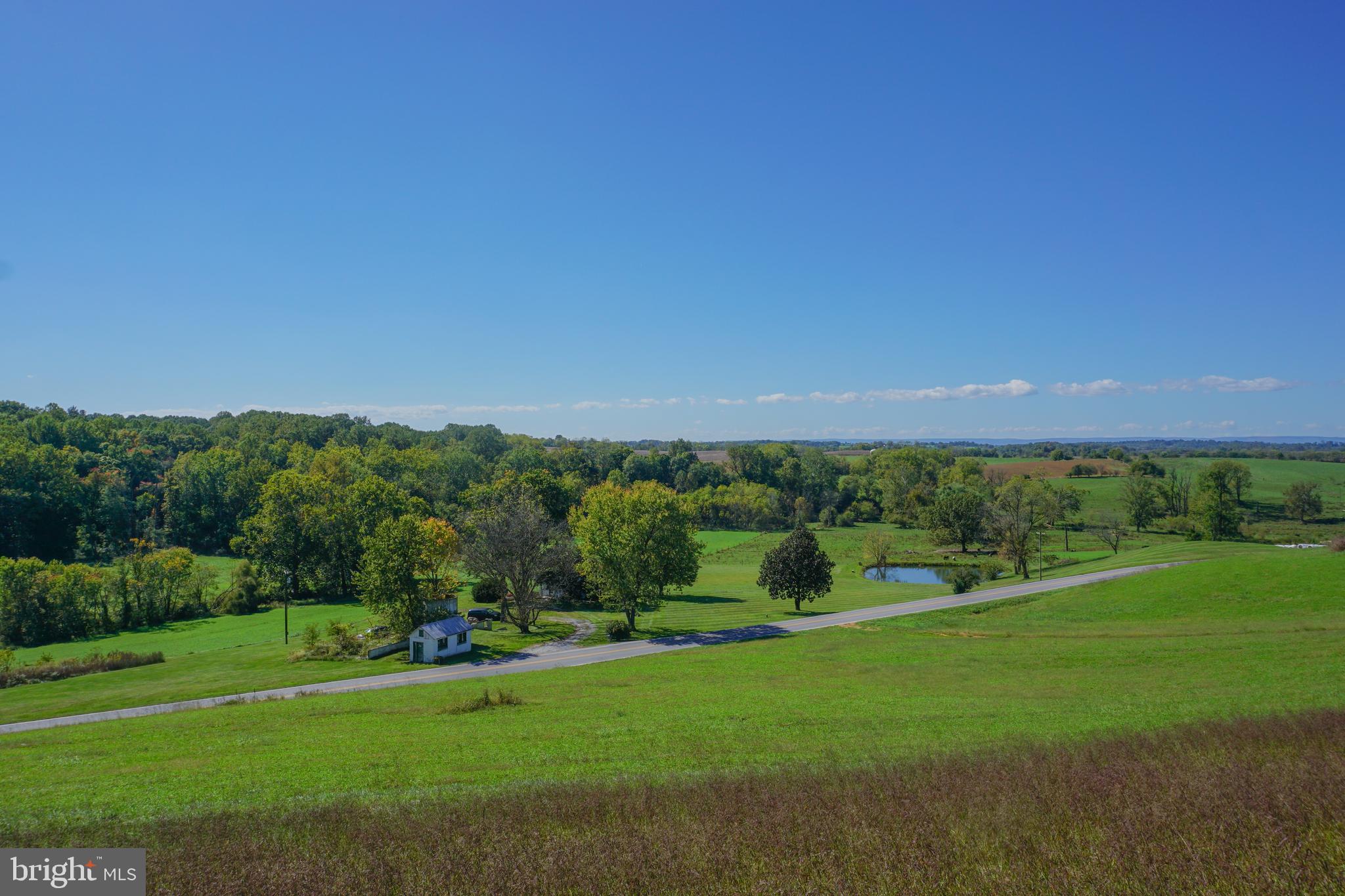 Discover an exceptional opportunity with this exceptional 120+ acres with land in both Frederick and Carroll Counties. The 40 +/- acre Carroll County parcel features preserved land with the right to build a residential dwelling on a 1-acre lot, while the 80 +/- acre Frederick County parcel is not preserved and contains potential for preservation / development. The hunting experience and lease value is significant. The property boasts a charming 3-bedroom, 3-bath house, equipped with a septic system designed, installed, and ready for a generous 7,000 sq. ft. addition or new house location. Enjoy breathtaking views overlooking a tranquil pond and a picturesque creek that winds through the heart of the farm. Each parcel boasts it’s own overlook offering full view of the entire farm. With 52 acres of tillable/pasture land and 55 of serene woods, this property offers the perfect blend of natural beauty and potential for your dream home or investment. Don’t miss this unique chance to own a piece of paradise!