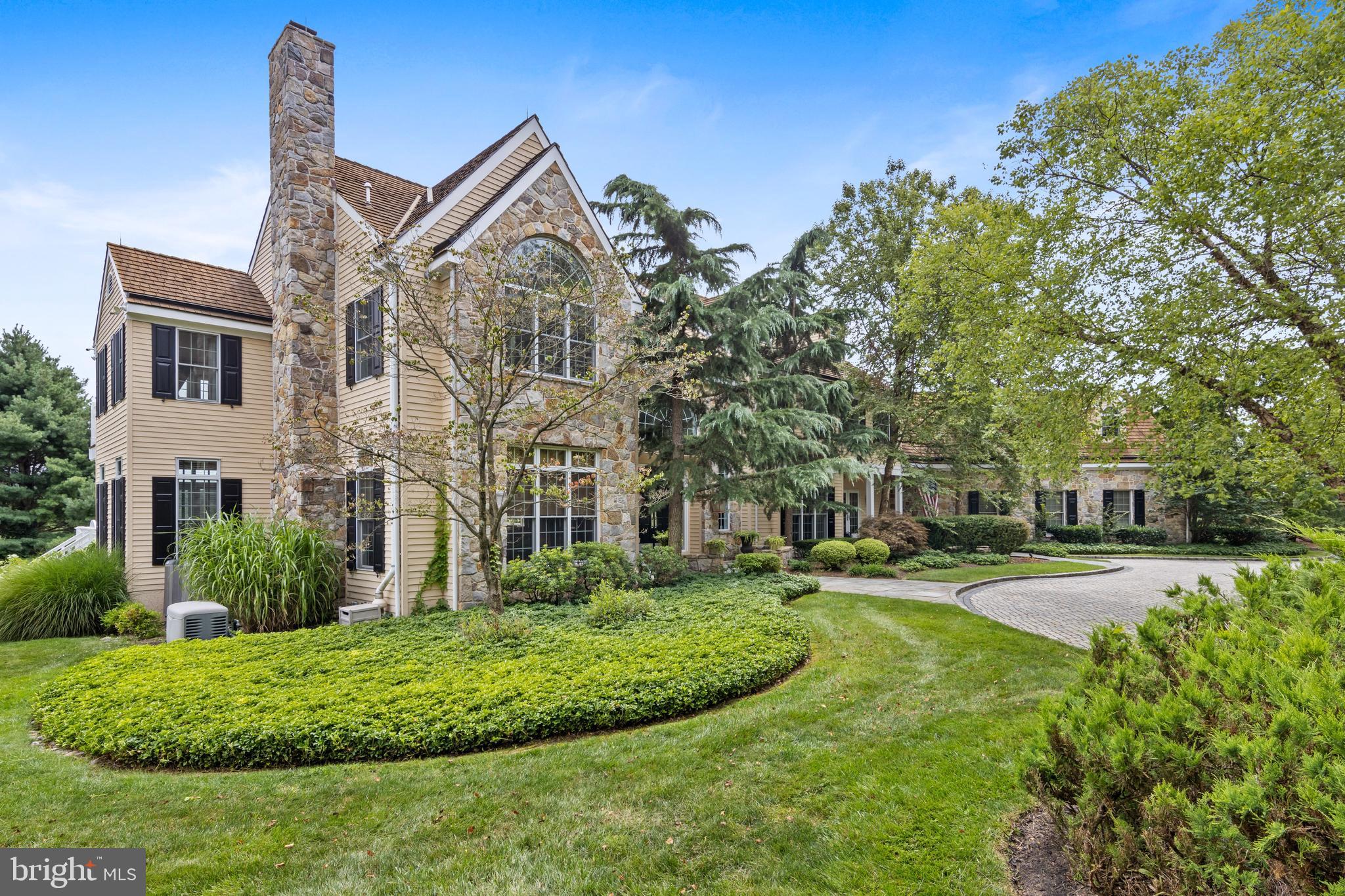 2040 Union Hill is a classic stone and clad home with stunning views of rolling hills and the pond at Four Oaks Farm. The traditional exterior reveals an open floor plan perfect for any decor and today's lifestyle. A large marble foyer welcomes you to the two story great room looking onto a beautifully landscaped vista. The first floor offers an attractively appointed living room with gas fireplace, a private office with green marble and cherry floors, formal powder room, great room with craftsman floor to ceiling stone fireplace and a wall of windows overlooking a fabulous view with deck access to hot tub, television and chef's kitchen. The kitchen is a cook's delight that flows to a spacious dining room that can accommodate all of your entertaining needs. The solarium, mudroom, second half bath and access to four car garage with lift complete the first floor. The second floor boasts five bedrooms, a spacious main suite with double closets and marble bath, two large bedrooms with en suite and two additional bedroom with shared bath. A full basement with with walkout features a full bath , numerous finished areas and storage. This is a wonderful home to live in with a great location and close proximity to everything you need.