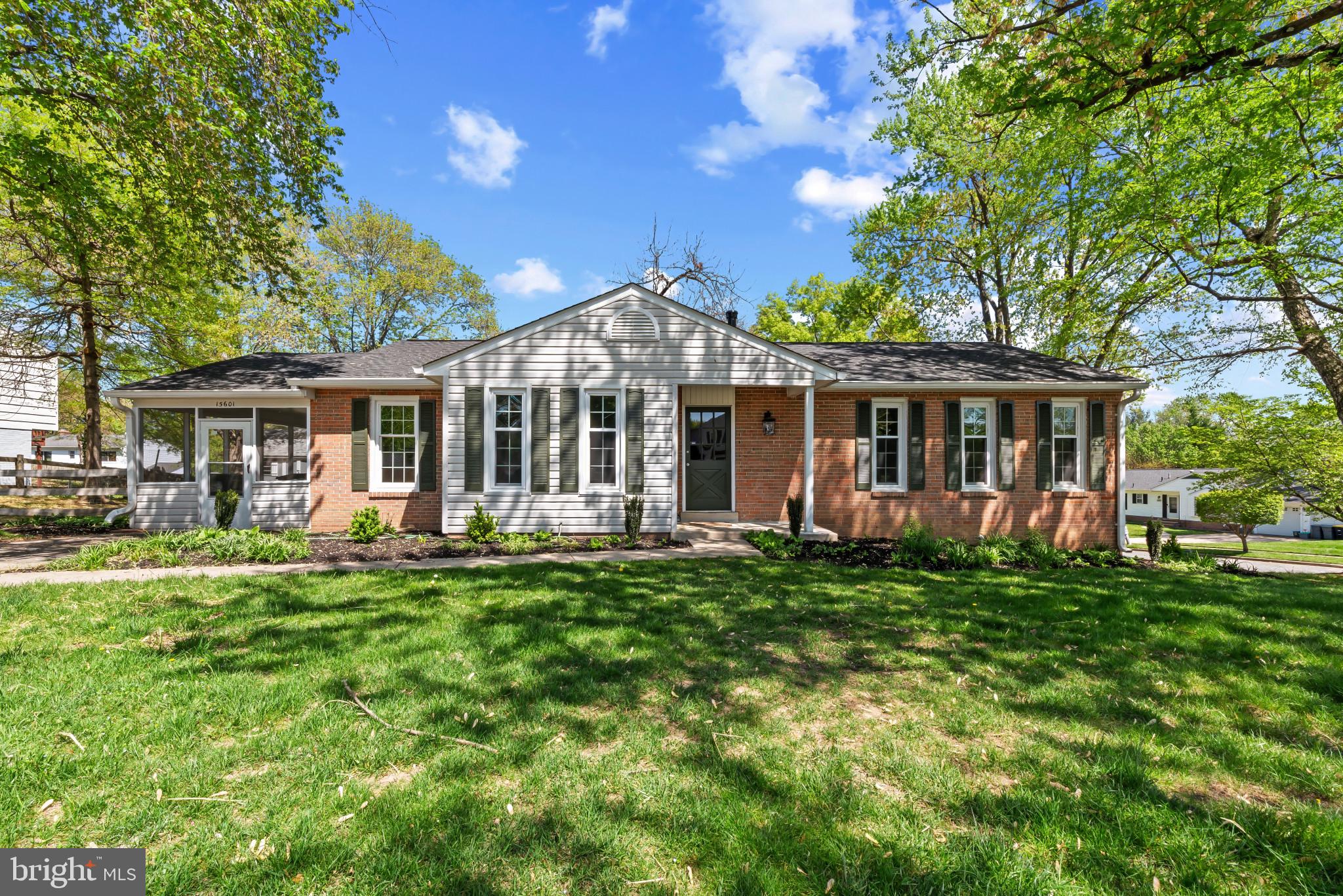 Beautifully updated brick-accented rancher residence offering 2,604 square feet, 3 bedrooms, and 3 full baths, ideally situated on a corner lot in desirable Sandy Spring Estates. The bright and open main level features a thoughtfully designed traditional floor plan, where gleaming floors flow from the foyer into a spacious living room and continue seamlessly into the formal dining room, highlighted by a timeless chandelier. Step into the stunning eat-in kitchen, complete with stainless steel appliances, upgraded countertops, crisp white cabinetry, a cozy breakfast area, and access to the porch. Just off the kitchen, a warm and inviting family room centers around a striking brick fireplace. The main level includes a comfortable bedroom, while the upper level hosts two additional bedrooms, including the gorgeous owner’s suite with dual closets and a spa-inspired ensuite bathroom showcasing exquisite tilework. The bright, fully finished lower level offers a versatile recreation room with walk-out access, a full bathroom, a generous bonus room ideal for a home office or guest space, and a flex space perfect for laundry facilities with exterior access. An enclosed porch and the partially fenced back and side yards provide a peaceful outdoor retreat, perfect for relaxing or entertaining.