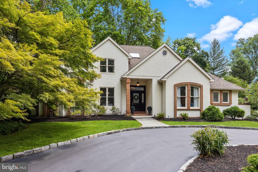 Brand new Bryn Mawr renovation! This one is priced to sell! This exquisite property pairs modern amenities with  an elegant aesthetic setting in sought after Lower Merion Township. This 4  Bedroom 3.5 Bathroom , 3200 square-foot residence is located on the desirable north side of Bryn Mawr.
The circular driveway and parking create a welcoming entry into this mainline home. The large front center hall area leads into a spacious dining room and living room with a gas fireplace. Two sets of French doors open up to the oversize great room with a brand new built-in entertainment center, extra large ceiling fan, gas marble fireplace, and cathedral ceilings.
The new all white gourmet kitchen contains a subzero refrigerator, wolf range, hood, and quartzite countertops. The kitchen abuts to a circular breakfast nook with five windows, viewing the exquisite outdoor patio oasis. Brand new navy blue striped awning provides outdoor shelter when enjoying the .71 acres, which includes a secluded backyard. One of the best parts of this house is the primary bedroom and bathroom suite located on the first floor. Dramatic light filled cathedral ceilings, twin overhead bedside pendant lighting and custom trim work throughout highlight this fabulous space. The bathroom suite has marble countertops on each vanity, a soaking tub and walk-in shower with marble accents. The second bedroom which is also located on the first floor offers a full private bath tile tub/shower combination. The second floor includes two additional bedrooms with a completely renovated Jack and Jill bathroom. There is a large unfinished attic space that can be furnished for additional living or used for storage. This location provides a rare opportunity for buyers wanting a location within walking distance to the R5 train, distinguished schools, upscale shopping and restaurants, and the lovely Airedale park. Turnkey is an understatement! Don’t miss out on the chance to make this stunning piece of real estate yours- schedule a viewing today!