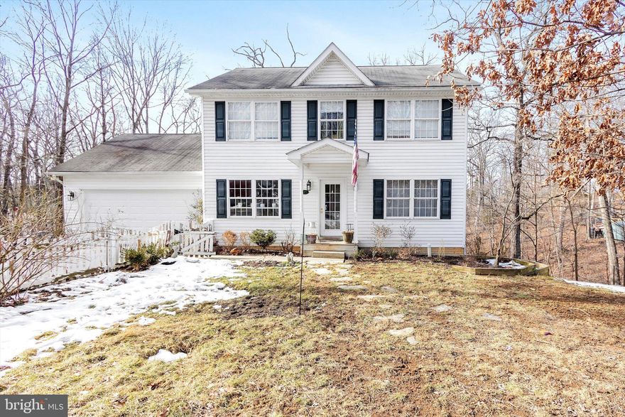 Check out the new professional photos of the outside and the floorplan photos with measurements! This home is continuing to get ready for inside photos next week! This custom 5-bedroom 3 full bath home in Blue Ridge Acres is deeded on three lots rounded to .79 secluded acres with a stream.  The Blue Ridge Acre subdivision has amenities of a community outdoor pool and private community Shenandoah River access via an optional yearly fee through the Blue Ridge Acres Community Club!!! (See Docs-fees-rules-membership application) There is also a mandatory HOA called Blue Ridge Acres Civic Association INC., whom manages the road maintenance agreement and the and short list of  Covenants , Rules, & Restrictions for the neighborhood.  (See Documents) 
The home at 137 Chestnut Lane rests at the end of the cul-de-sac. This three-story home's main floor features hardwood floors throughout the main level, an amazing kitchen with island overlooking the breakfast nook with bay window, the door to the inviting outside deck, as well as the family room with gas fireplace! The separate living room or formal dining area also has hard wood floors and could also be used as a home office with high-speed cable internet available!  The cutest mud room, with a little half door, leads out to the two-car garage with opener which has been used as a wood shop with an addition that was added and used as a spray or paint room. The upper level has a primary bedroom with wood flooring and attached full primary bath with a soaking tub, a separate shower, double sink vanity, linin closet, plus a walk-in closet.  Between the two other upstairs good-sized bedrooms, there is also a shared charming window seat space for reading and looking out the window, homework area, etc.  The cute built in storage bench has hidden storage underneath.  The finished basement has living area with ceramic tiles, two legal bedrooms with closets and egress windows and a shared full bath that awaits a new toilet to be installed by the new owner, plus has a separate rear entrance with a porch on the walkout level of the rear yard.  There is also a small room for storage! The yard is very private, and the three lots have a small stream that trickles across the backyard downhill from the home.   All rooms at the back of the home have an amazing view of trees and the small stream down the hill. It is a nice view from the front of the home as well as this home is at the end of a cul-de-sac with trees!  The adventures buyers can schedule a showing through their real estate agent NOW… while other buyers wait on inside photos while hoping this home doesn’t go under contract while they wait!  Perhaps you could be the new owner or know the new owner!