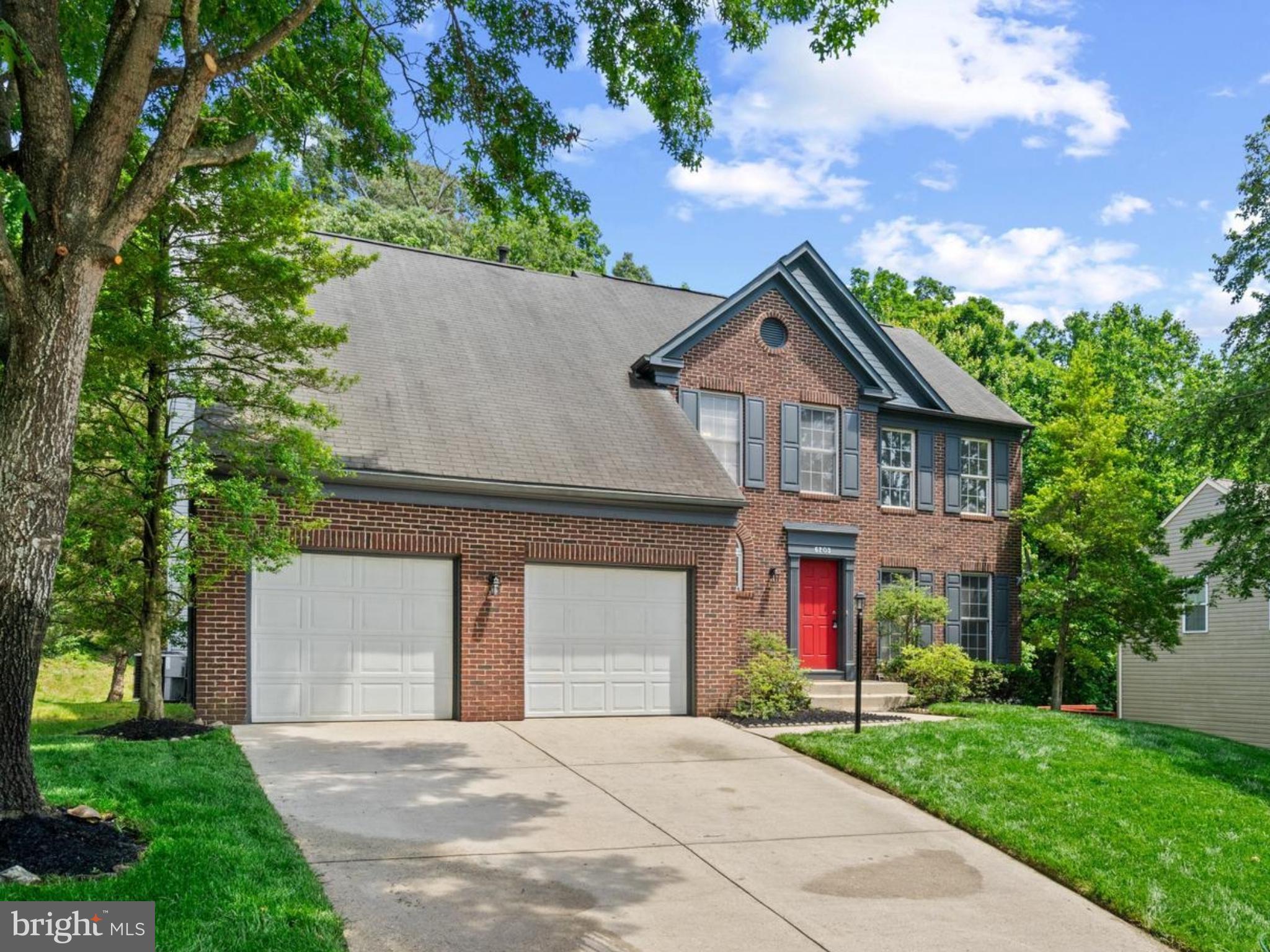 Set on a quiet street in sought-after Glenn Dale, 6203 Wood Pointe Dr offers over 3,600 square feet of beautifully designed living space with wooded views and versatile living areas. This expansive Colonial features 5 bedrooms, 3.5 bathrooms, and a layout that balances grandeur with comfort. A dramatic two-story foyer welcomes you inside, where near-floor-to-ceiling windows line the rear wall, flooding the main level with natural light.
The open-concept kitchen and living area includes stainless steel appliances, premium countertops, tile flooring, and a cozy gas fireplace. Just off the kitchen, a flexible family/dining room offers even more space for relaxing or entertaining. Upstairs, the spacious owner’s suite boasts a walk-in closet and a luxurious en-suite bath complete with dual vanities, a standing shower, and a soaking tub.
The fully finished walk-out basement features a second fireplace, wet bar, full bath, and generous open space—ideal for recreation, guests, or multi-generational living. Outside, enjoy a large deck overlooking a private, tree-lined backyard, plus a 2-car attached garage.
Nearby attractions include the Marietta House Museum, Glenn Dale Splash Park, and WB&A Trail. Residents also enjoy easy access to major commuting routes such as U.S. Route 50, MD-450, and I‑495, offering a quick trip into D.C., Annapolis, or Baltimore.