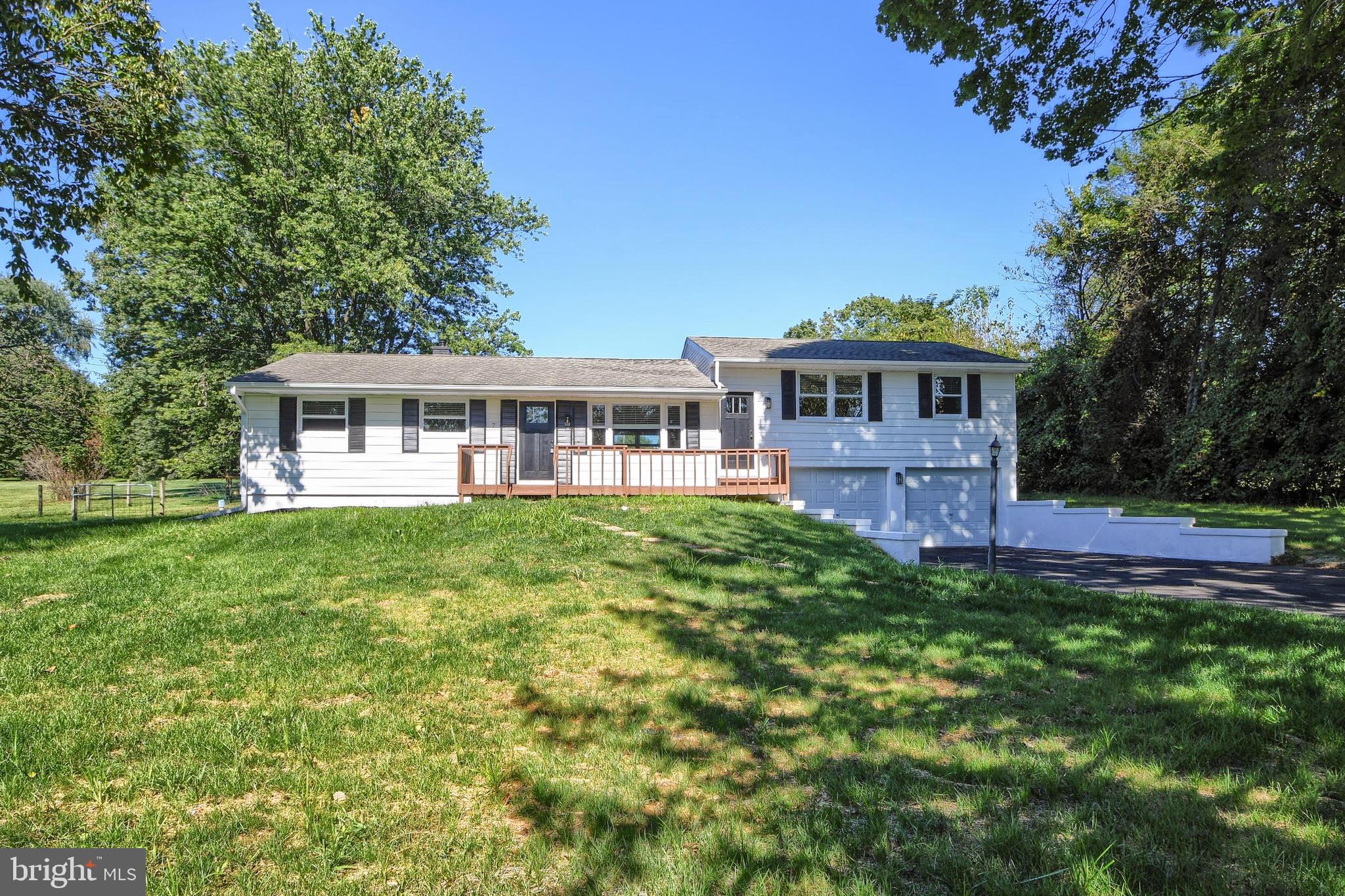 This lovely house has so much to offer and so many options. AS you walk in the front door you are greeted by homey living room with recessed lighting and wood flooring. This flows into the dining area and kitchen which boasts granite counter tops, subway tile and stainless appliances. There are 3 bedrooms on this level as well as a full bath. There is small set of stairs off the living room which lead to a separate living area. It could be used as an in-law suite, an extension of the original living area, office or entertainment area. Use your imagination! This such great space. It has a beautiful kitchen, bedroom, laundry, bathroom and living room. The kitchen has an outside entrance to rear yard and the living room has an entrance to the front porch. The full basement has laundry hookups and access to the garage. The yard is partially fenced and perfect for pets and entertaining. Come see this and make it your own.