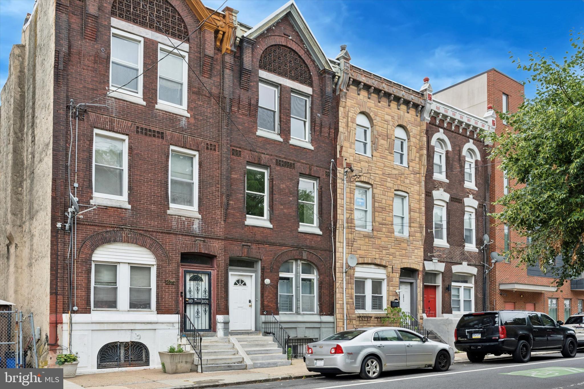 Welcome to 2013 N. 15th Street, a prime investment opportunity right on Temple University's campus. This spacious three-story duplex with a basement offers flexibility, strong rental potential, and tons of upside. Only one unit is currently occupied, making it ideal for both investors and owner-occupants looking to capitalize on this unbeatable location. The first unit is a large 2-bedroom, 2-bath with multiple living areas, a back deck, yard access, and basement storage with its own full bath and laundry. The second unit spans the second and third floors and can function as a 4- or 5-bedroom with one full bath, a kitchen, and connected bedrooms offering a flexible layout. With high ceilings, great natural light, and a location in the heart of Temple’s rental zone, this property is a must-see for anyone seeking strong long-term value in one of Philly’s hottest rental markets.