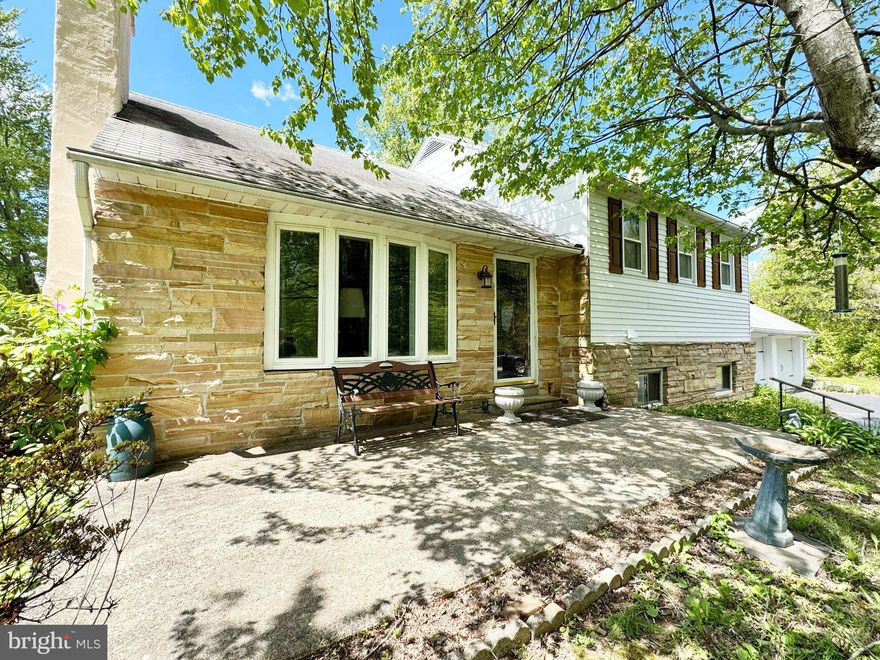 This classic mid-century home is set on approximately 2.56 scenic acres with open, level grounds ready for gardens, recreation, entertaining, or whatever your outdoor imagination inspires. A large driveway offers abundant parking for multiple vehicles, guests, hobbies, equipment, or outdoor toys. Hardwood floors add warmth and character throughout much of the home, while the updated kitchen features timeless subway tile and a clean, modern feel. The bright Florida/three-season room overlooks the private backyard and offers the perfect place to relax and enjoy the surrounding landscape. ** Additional highlights include a two-car garage with bonus storage, an updated bathroom, a full unfinished basement with exceptional storage and finishing potential, and a walk-up attic with stair access offering flexible bonus space. There is potential for another bathroom in the laundry room and/or the basement. Conveniently located with quick access to Routes 29, 663, 73, 309, and the Pennsylvania Turnpike, this home offers space, flexibility, and privacy without sacrificing convenience.