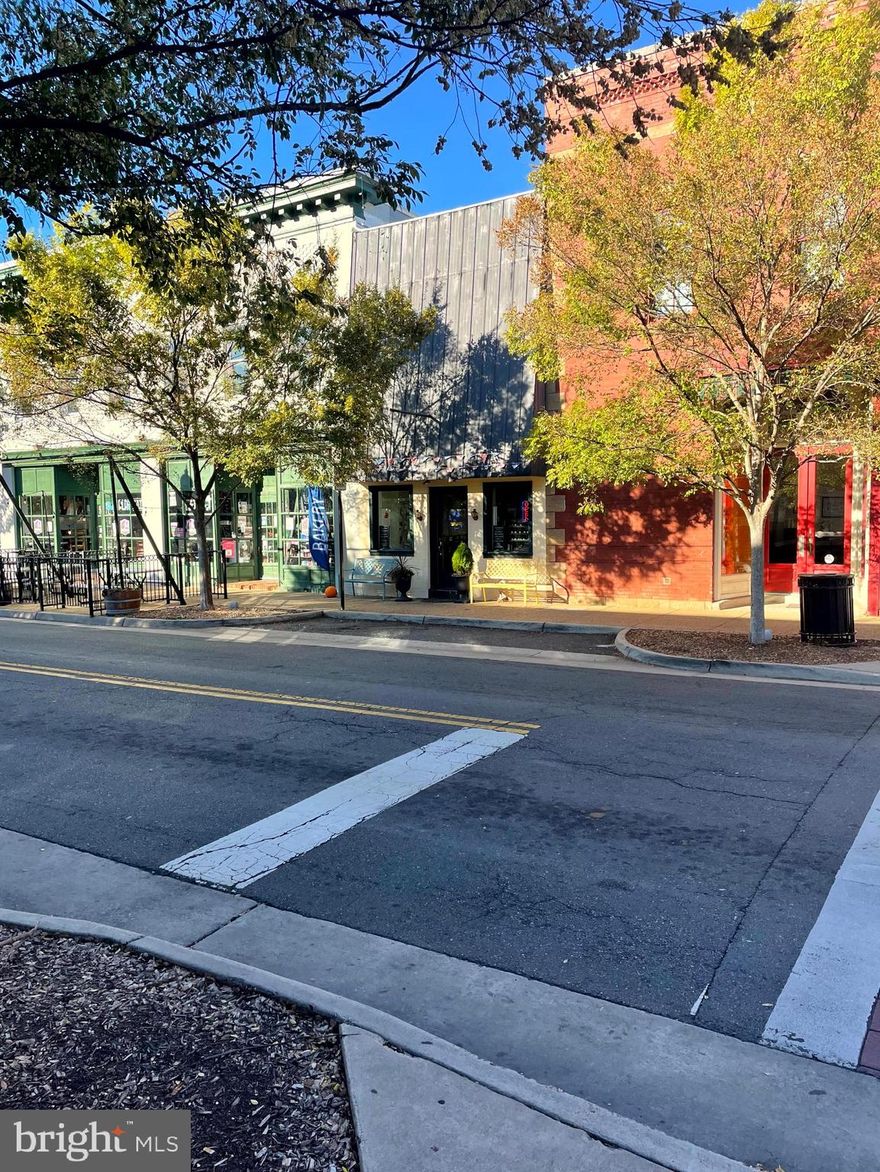 Offered as an investment sale, this 1,425 SF retail storefront presents a rare opportunity to acquire a stabilized asset in the heart of a thriving historic district. The property is leased to a well-established bakery through 2/28/2027, generating an NOI of $27,457. With strong local demand and a walkable Main Street setting, it offers stable income today with future potential for conversion to restaurant or bar use. The high ceilings could accommodate mezzanine-level seating or storage, creating an attractive opportunity to unlock additional value in a key downtown location. Nestled in the center of Old Town Manassas, the property enjoys excellent visibility and steady foot traffic from nearby shops, restaurants, offices, and community destinations. The area hosts frequent festivals and events that draw visitors year-round, reinforcing its role as a regional attraction. The location offers convenient access to Rt. 28 and Rt. 234/Sudley Rd., providing strong connectivity and sustained demand for local retail tenants.