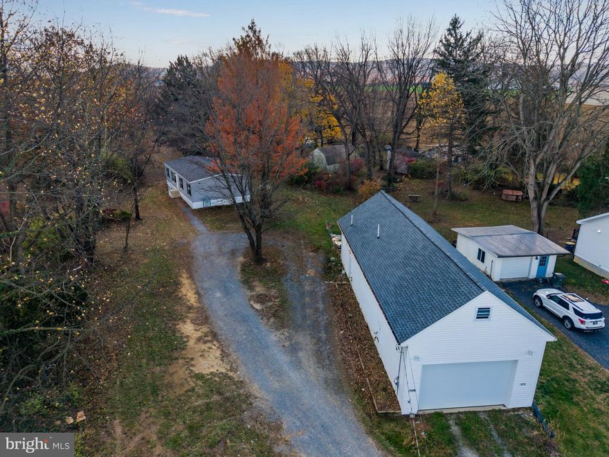 3 separate parcels being sold as one. Parcel 1: 1.27 acres with a 2020 Manufactured home with 4 bedrooms and 2 bathrooms. Parcel 2: 0.10 acres with a garage built in 2021 with garage area and a 1 bedroom, 1 bathroom apartment. Parcel 3: 0.24 acres of vacant land.

 Welcome to 1323 Church Street — an incredible opportunity in the highly sought-after Cumberland Valley School District. This property gives you space, flexibility, and options you rarely find at this price point.

The main home offers 4 bedrooms and 2 full baths with a comfortable, functional layout and plenty of room for everyday living. Just steps away, the detached garage setup is a major bonus: a huge garage/workspace with an oversized garage door, 12 foot ceilings with room for a car lift to be installed and a full 1-bedroom apartment. Perfect for guests, extended family, rental income, or a great home-office setup.

This property checks a lot of boxes for both homeowners and investors. Opportunities like this don’t hit the market often—don’t miss it.