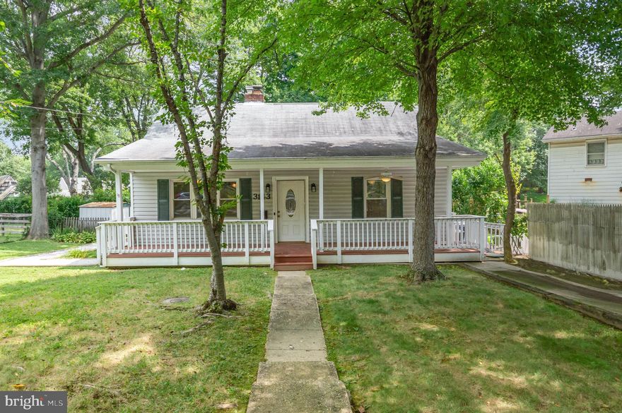 $15,000 price improvement.  Open House Saturday 1-3pm
Nestled in the desirable Bel Air neighborhood, this charming single-family home offers a fantastic opportunity just 8 miles from Washington, D.C. and only 1.5 miles from the heart of Falls Church City. Featuring 3 bedrooms and 2 full bathrooms, including a recently updated main-level bath, this home blends comfortable living with incredible potential.

The inviting living room is anchored by a classic wood-burning fireplace, creating a warm and cozy gathering space. A standout feature is the expansive one-level rear addition that spans the full width of the home, providing flexible space perfect for a family room, home office, or extended dining area. Step outside to enjoy screened rear deck for relaxing summer evenings or unwind on the covered front porch overlooking the quarter-acre lot.

With solid construction and well-maintained systems, this home has great bones and is ready for your personal touch and updates. Its prime location, generous lot size, and thoughtful layout make it a rare find with endless possibilities.