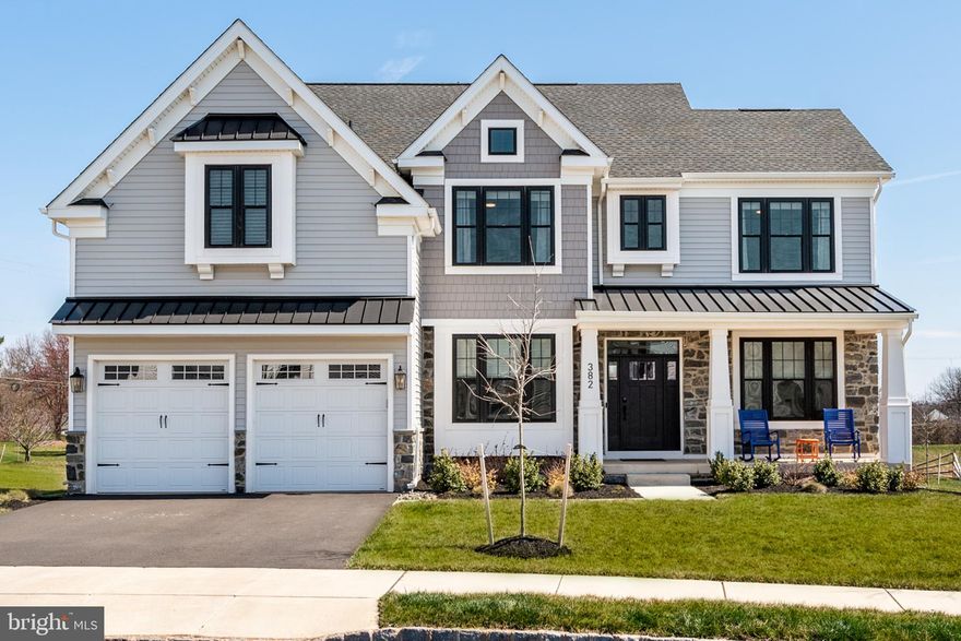 Welcome to luxury living at its finest!  Situated on one of the premium neighborhood lots, this magnificent, like-new construction home offers an impressive 3,200 square feet of living space, plus a sprawling finished basement that adds even more versatility to your lifestyle, plus 1,000 sq ft!  This Chapel Hill model offers 5 bedrooms, 4.5 bathrooms, a 2 car garage with EV charging outlet, large mud room with built in bench and cubbies, and so much more. Full of upgrades, no detail has been spared in this home, where every corner exudes sophistication and charm.
As you enter the front door, you are greeted by gleaming 6-inch European Oak hardwood floors that span the entirety of the first floor, setting a tone of elegance and luxury.  The 9-foot ceilings and loads of natural light further enhance the sense of space and airiness throughout the home.
The heart of the home lies in the gourmet kitchen, a place that will inspire your inner chef.  From the expansive 8 foot island, to the 42 inch cabinets, double wall ovens, top of the line appliances, stunning quartz countertops, walk in pantry, and 5-burner gas range, this culinary masterpiece is sure to impress.  The butler’s pantry adds both style and functionality to this culinary haven.
Entertain with ease with the open floor plan, where the kitchen seamlessly connects to the living room with custom fireplace, creating a cozy ambiance.  Host elegant dinner parties in the formal dining room and utilize the flex room as an office, formal living room- the choice is yours.  A convenient placed powder room completes the main level.
Upstairs, retreat to the lavish comfort of the master suite with custom wainscoting, complete with a spa like bathroom with a soaking tub, double vanities, shower with bench and two finished walk in closets.  Another bedroom, fit for royalty, boasts its own attached bathroom and walk in closet.  The other two bedrooms offer ample space, generous walk in closets, and share the hall bathroom. The convenient upper level, oversized laundry room, complete with cabinets and a walk in linen closet ensures that chores are a breeze.
Descend to the fully finished basement, where the opportunities are endless!  Here you will find the fifth bedroom, currently used as a home gym, with a full bathroom.  This space has so many uses, you will be sure to find the perfect one for you. The unfinished section of the basement is perfect for all your storage needs.  
Outside, entertainment options continue with an oversized stamped concrete patio, with built-in fire pit, that is perfect for those summer BBQs, or cozy evenings under the stars.  Always wanted a pool of your own?  This yard is the perfect space to add one.  This home truly has it all.  Situated in a desirable neighborhood, it offers the perfect combination of luxury and comfort.  The HOA allows fencing and solar panels.  Conveniently located close to running & bike paths, parks, Skippack Village, Main Street Harleysville, and easy accessibility to major highways.  Don’t miss out on the opportunity to make this exquisite house your home.  Schedule a showing today and prepare to be amazed!