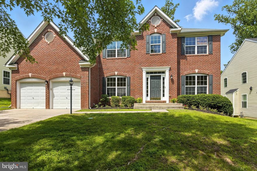 REDUCED $25,000 - Impressive 3-level colonial with modern comforts and a prime location. This brick-front detached home features 4 spacious bedrooms and 2.5 bathrooms, including a luxurious spa-like Zen en-suite in the primary bedroom. All rooms offer ample space and wall-to-wall carpet. 

The gourmet kitchen is equipped with 42" cabinets, granite countertops, a massive center island with a built-in 5-burner stove, plenty of storage and drawers, and stainless steel appliances. The family room offers a cozy marble-surround fireplace, while the main-level library/study includes elegant French glass-pane doors. Separate living and dining rooms provide additional space to host family events. 

The home also includes a 2-car garage and a deck that leads to a relaxing backyard. And a customizable lower level with a rough-in that offers endless possibilities - a media room, gym/workout space, home-based business,  private office, kids' play area, storage,  entertainment /recreation lounge, and possibility of additional living space for bedrooms or generational living.  Dream the vision and create the space. 

Modern amenities throughout and in excellent move-in condition. Located close to DC, Virginia, and several military installations. A rare opportunity with a 3.25% VA assumable loan available.