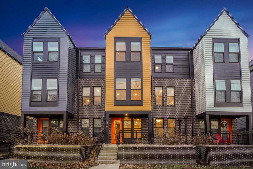 Welcome to 8012 Grove Street, located in The Towns on Grove, an intimate contemporary
townhome community within the vibrant ArtSpace Arts Campus in Downtown Silver Spring.
Built in 2021, this thoughtfully crafted residence offers a private elevator servicing all three
levels, extensive upgrades, and a garage.

Distinctive details and refined design elements are found throughout, including high ceilings,
LED recessed and pendant lighting, abundant natural light, generous storage, and striking
elongated windows. The entry level features a welcoming front porch, an inviting foyer, an
bedroom (also suitable as an offiice,) a full bathroom, and access to the garage.
The main level presents a gracious living room and an open dining area with a storage closet
and balcony access. The impressive, state-of-the-art kitchen showcases a Samsung stainless
steel appliance suite, Caesarstone quartz countertops, soft-close drawers and cabinetry, a
HUGE center island breakfast bar, pendant lighting, a five-burner gas stove, herringbone-
patterned tile backsplash, a concealed pull-out waste cabinet, two pantries, and flows
seamlessly into a bright breakfast room with drum lighting. This level also includes a powder
room and a wonderful balcony with ample space to entertain.
The third level offers three bedrooms, a laundry closet, and two beautifully appointed
bathrooms, including a generous primary suite. The owner’s retreat features a sizeable walk-in
closet, direct access to the elevator, and a private bath with a frameless glass-enclosed shower,
tile flooring, and a dual-sink vanity. Down the hall are two additional bedrooms and a shared
hall bathroom with a tub/shower combination, completing the upper level.
Enjoy life in this welcoming neighborhood — the prime location provides exceptional
convenience and access to everything this remarkable area has to offer. With a strong sense of
community and proximity to shopping, grocery stores, two farmers’ markets, restaurants, pubs, and entertainment, you’ll appreciate both dynamic Downtown Silver Spring and nearby eclectic
Takoma Park. Just steps to the MARC Train Station and the Red Line Metro, as well as parks,
playgrounds, Montgomery College, its Cultural Arts Center, the American Film Institute, and an
array of shops, restaurants, theaters, gyms, and everyday amenities — this is effortless urban
living at its finest!