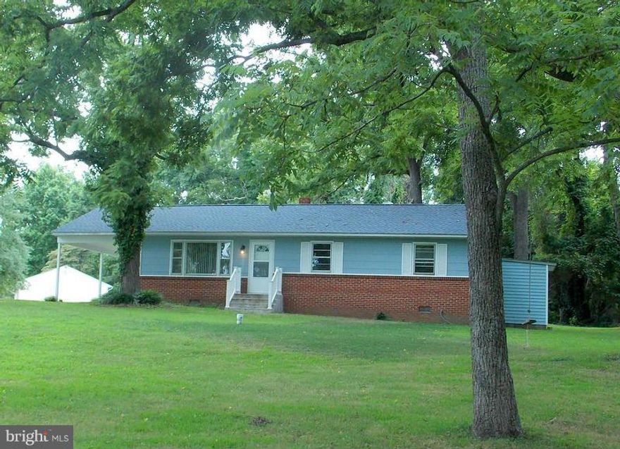 This cute waterfront home in a small community of 7 homes, is a REAL GEM!!  Major systems are updated; new roof, new well, new water heater, 5 year old furnace, new vanities, sinks and toilets in baths, new int & ext doors.  Hardwood floors throughout. Large kitchen w/ great remodeling potential. The beautiful front yard is the 2nd lot (8678 sq.ft) for a total of .71 acres at this price. Pier too!