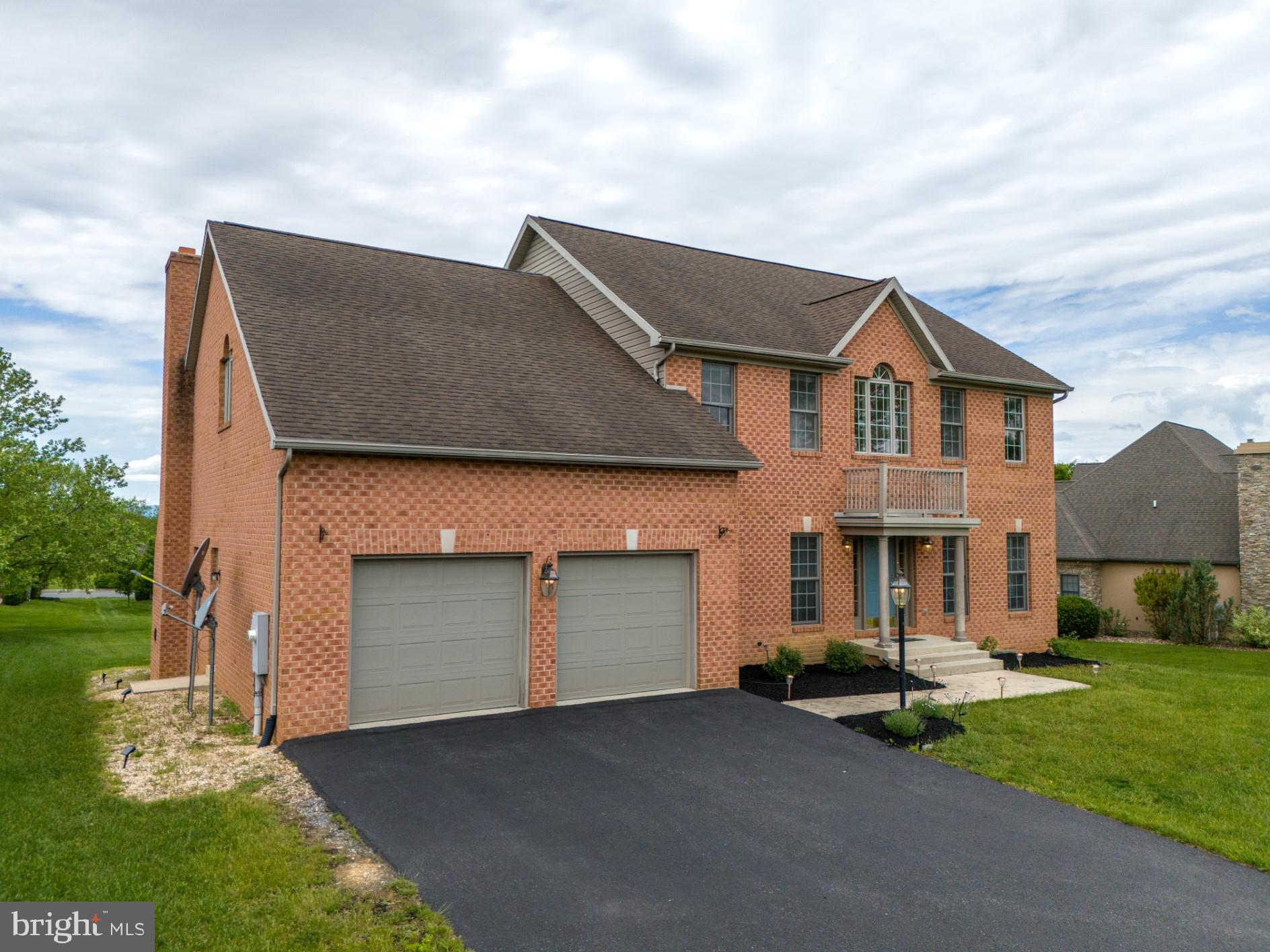 This stately all-brick Colonial offers timeless elegance in Greencastle’s prestigious Heritage Estates community. Situated on a manicured 0.51-acre lot along a quiet, low traffic street, this 3-story home is located in the highly sought-after Greencastle-Antrim School District—renowned for academic excellence.
With over 4,900 square feet of finished living space, the home features 5 bedrooms, 3.5 baths, and a traditional floorplan designed for both everyday living and elevated entertaining. The main level boasts rich hardwood flooring throughout a welcoming layout that includes a formal living room, dining room, private office, laundry room, and an open kitchen with Corian counters and breakfast nook. A sunken family room with cathedral ceilings, a striking brick fireplace, and oversized windows opens onto a 20'x46' deck—overlooking the huge back yard.
The upper level hosts a luxurious primary suite with a sitting area, dual walk-in closets, and a spa-like bath featuring a jetted Roman tub, vaulted ceilings, and double vanity. Three additional bedrooms and a second full bath complete the top floor.
The finished lower level is a self-contained suite, offering a bedroom, full bath, living room with fireplace, kitchenette, and walkout French doors—ideal for multi-generational living, a private guest retreat, or live-in au pair.
Additional highlights include crown molding, energy-efficient double-pane windows, upgraded finishes, and architectural details throughout. This rare opportunity offers elegance, space, and flexibility in one of Franklin County’s most desirable neighborhoods. Call today to schedule your private showing!