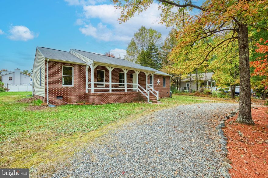 BEAUTIFUL ONE LEVEL LIVING - BRICK FRONT RANCHER FEATURING ALMOST 1,700 SQ FT, CONCRETE FRONT PORCH, WELCOME! FOYER WITH HARDWOOD FLOORING, SPACIOUS ROOMS INCLUDING: FAMILY ROOM WITH A BRICK WHITE WASHED GAS FIREPLACE, AND A WOOD MANTEL, SPACIOUS LIVING ROOM, FORMAL DINING ROOM WITH A FRENCH DOOR - WOULD MAKE A GREAT OFFICE SPACE AS  WELL, EAT-IN KITCHEN WITH GRANITE COUNTER TOP/STAINLESS STEEL APPLIANCES/CERAMIC TILE, LAUNDRY/UTILITY AREA/MUDROOM OFF THE KITCHEN WITH ACCESS TO BACK PORCH, PRIMARY BEDROOM WITH LAMINATE FLOORING AND MASTER BATH FEATURES A NEW VANITY, NEW TOILET AND HAS CERAMIC TILE FLOORING, 2ND BEDROOM WITH LAMINATE FLOORING, 3RD BEDROOM HAS BOOKSHELF STORAGE FROM FLOOR TO CEILING AND NEW CARPET, LAUNDRY ROOM INCLUDES A WASHER AND DRYER, BACK PORCH FOR RELAXING OR FAMILY FUN, DOUBLE LOT MAKING IT A 1/2 ACRE, GARDEN AREAS HAVE BEEN STARTED - BRING YOUR SEEDS TO CONTINUE THE BEAUTIFICATION OF THIS LOT. ORIGINAL OWNER TOOK LOVING CARE OF THIS HOME AND WORKED DILIGENTLY IN THE GARDENS. ONE OF MY FAVORITE FEATURES OF THIS PROPERTY IS THAT IT FEELS RUSTIC WITH LOTS OF CHARM AND THE LONG 1/2 MOON DRIVEWAY FOR AMPLE PARKING AND EASY DIRECT ACCESS TO THE FRONT DOOR.  THIS HOME IS VERY PRETTY WITH A GREAT FLOOR PLAN FOR ONE LEVEL LIVING.  FRESHLY PAINTED GRAY INTERIOR WALLS WITH BRIGHT WHITE SEMI GLOSS TRIM AND NEW GRAY CARPET. SO CUTE AND FRESH!