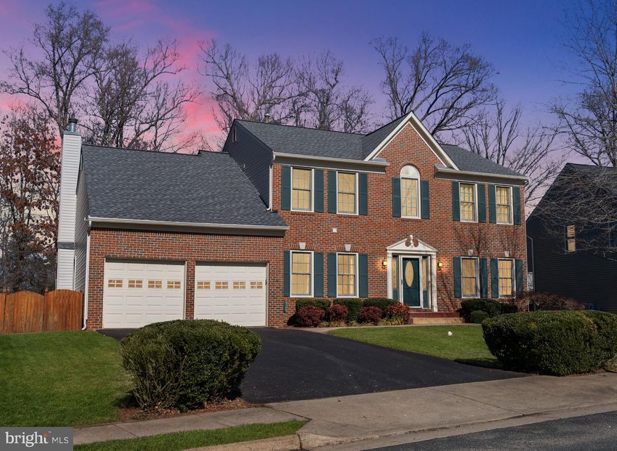 Must see this amazing and spacious 4325 SF home, with many upgrades, to include all-new Anderson double-hung windows, gourmet kitchen, with new 42' kitchen cabinets, self-closing doors and drawers, hidden trash can, Granite countertops, huge island with sitting area, Stainless steel appliances. Elegant Brazilian Cherry Hardwood flooring. Living room with cathedral Ceiling, you will have plenty of light to come in through the generously located Anderson Windows, High efficiently vent-less gas fireplace. This home has an office in addition to the formal living room and the adjacent dining room, plenty of space in this open floor plan home.  All Bathrooms have been recently upgraded with beautiful granite tops and new cabinets, flooring and fixtures.  Master suite with cathedral ceiling, huge walk-in closet, shower, and soaking tub. Every room in the house has been Freshly painted. 9-foot ceiling on main level.  Beautifully finished walk-out basement with in-law suite complete with kitchenette and full refrigerator, stove, oven and microwave, and a movie theater/game-room , or a wet bar to your liking. Two large basement bedrooms, 6th bedroom NTC, and plenty of space to entertain family and friends. Recently updated water heater and roofing. New in-ground wifi-controlled sprinkler system. Private fenced in back yard, backs to the trees, has 2-levels large no-maintenance trek deck, Hot tub, Huge stamped concrete patio, shed. walking distance to the community pool. . Located in a very well sought-after neighborhood at Hampton Oaks. Great location in North Stafford close to shopping, schools, commuter lot, and I-95