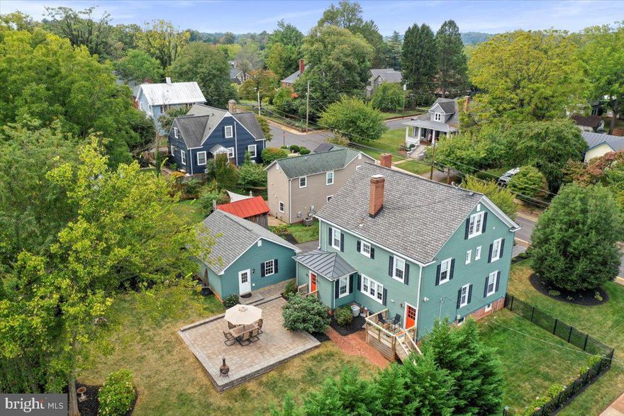 Back on the market - at no fault of seller! Stunning Home in the Heart of Culpeper! This thoughtfully preserved home blends the grace of the original architectural details with modern sophistication. This 4 bed/3 full bath home boasts hardwood floors throughout. The inviting living room is full of details likes built in shelving and cabinetry that frames a window seat, perfect for relaxing after a long day. The gas fireplace creates a cozy area to gather. The spacious and light-filled kitchen boasts updated cabinetry, and all new appliances with granite countertops. There is a porch off the kitchen, perfect for your morning coffee! Off the kitchen is a large butler's pantry, perfect as a breakfast room, with built-in and back lit cabinetry. Through the doorway of the butler’s pantry is the dining room, complete with built in corner cabinets. Down the hall, there is a large pantry, full bath and family room. The family room, with built-in bookshelves and door into the backyard, could be used as a main level bedroom as it is next to a full bath. Upstairs, the primary bedroom is quite spacious with a sitting area, walk-in closet and two additional closets. The primary bath boasts dual sink vanity, tons of natural light, separate water closet, shower and walk-in closet. Two additional spacious bedrooms, hall bath, and large laundry room (with new washer and dryer) round out the 2nd floor. Take the stairs up to the 4th bedroom! This large area is a multi-purpose area depending on the need, but is designated as a bedroom with two closets and built-in bookshelves. The basement is unfinished storage area, but does boast a throwback half-bath, and storage area that is the perfect temperature for a wine cellar. The fully fenced back yard is resplendent with a large paver stone patio, blooming fig tree, fruit bearing peach tree and landscaped flower beds. There is a 2-car detached garage with side entrance and tons of storage, as well as a separate 3rd garage on Chandler Street. Recent updates/renovations - the kitchen boasts all brand-new appliances, the plumbing to the upper level bath has been completely redone, extensive landscaping, power washing of the entire exterior, repainting of front porch, stairs and doors. They have done all the work, so you do not have to! This property sits two short blocks to Main and Davis - the historic Old Town that is full of shops and restaurants as well as a stone's throw to historical and recreational sites that Culpeper has to offer.