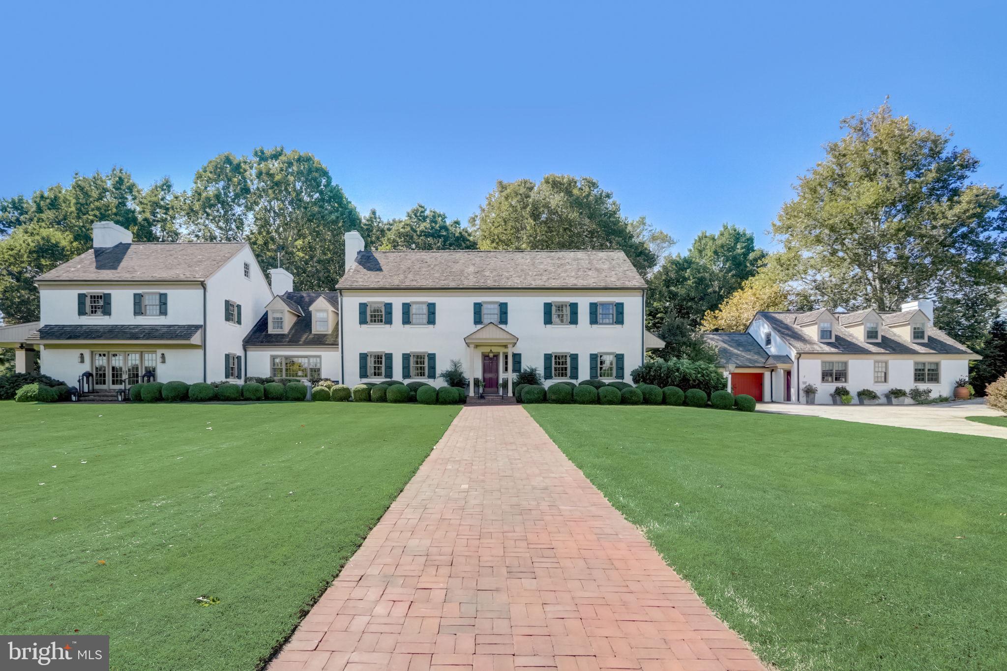 Nestled amid picturesque and peaceful Chester County horse country is this sweeping, stately 23-conserved acre estate, unlike any other. Welcome to Fox Quarry. The original part of this classic farmhouse-inspired estate was constructed in 1973, and over the years magnificent additions were built to match the original structure, and meticulous authentic period elements and upgrades were implemented to create a masterpiece of beauty. This spectacular property is now a breathtaking blend of nearly 7,000 sq. ft. The main residence was designed for entertaining with an expansive open floorplan with each room overlooking a different garden or terrace. Custom millwork and masonry are just the beginning of the craftsmanship you'll find here. Hardware from Ball & Ball and Baldwin brass, reclaimed brick and hardwood flooring offer all of the fine details you would expect in an estate of this nature. The guest cottage features 2 separate apartments each with its own terrace. A delightful potting shed, and a myriad of stone and brick terraces surrounded by professional verdant landscaping that’s set in an unequaled enclave. The soaring fieldstone barn constructed in 1998 has many different use possibilities. It is a brilliant fusion of yesteryear architectural features and modern must-have amenities. There is nothing left to do but simply appreciate this home’s one-of-a-kind attributes. Fox Quarry has an agricultural easement and is in Act 319. This Chester County location is easily accessible to Philadelphia and northern Delaware.