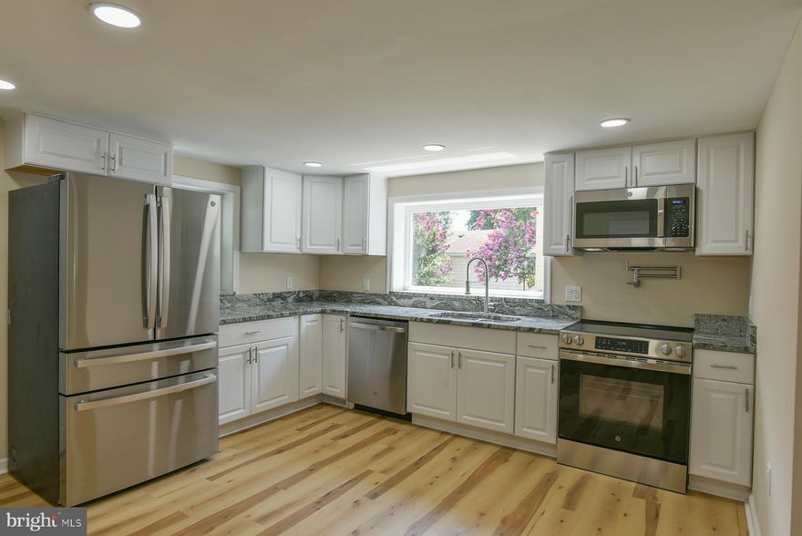 Charming and completely renovated cape cod  offering 4 bedrooms and 3.5 bathrooms, perfectly blending modern updates with timeless character. Every detail has been thoughtfully addressed, leaving nothing for you to do but move right in. Major upgrades include updated electrical and plumbing systems, new flooring throughout, fresh paint, stylish fixtures, and an all-electric central heating and cooling system for year-round comfort.  The fully renovated kitchen is a true showpiece, featuring high-end GE Profile appliances, granite countertops, a convenient pot filler, and ample cabinet space for storage. The main level includes a family room, desirable first-floor bedroom with an adjoining full bath.  Upstairs, you’ll find three spacious bedrooms, a beautifully appointed full bathroom, and a laundry room for ultimate convenience.  The finished lower level provides additional living space, perfect for a family room, game room, or home office, and offers walkout access to the expansive, level backyard—an excellent space for entertaining, gardening, or play. Relax and unwind on the covered back patio, a peaceful retreat to enjoy the outdoors in any weather. This home truly combines style, comfort, and functionality in a prime location.  Convenient to I-81, shopping, restaurants, schools, etc!  Don't miss this great home!