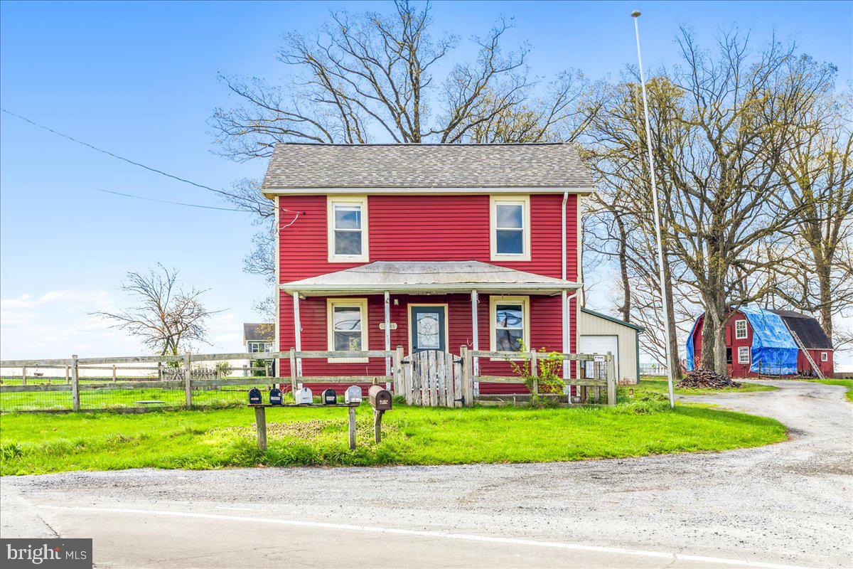 Very Charming Historic home on 1.02 acres in an amazing Frederick County location! Beautiful rural views in every direction. Less than 5 years ago the siding, roof, windows and baseboard heaters were replaced. Approximately 8 years ago the kitchen cabinets, countertops, and appliances were replaced. The pellet stove in the cellar was also replaced about 8 years ago. There is a full attic with stairs for ample storage. The basement beams and joists were replaced by an experienced licensed builder/ contractor less than 5 years ago. Exterior amenities include partially fenced in yard around the home, lots of driveway parking and a Pole barn/ Oversized detached garage with a car lift that is 30' by 30.