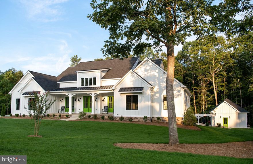 To be built by Simply Home, one of Virginia’s most respected and sought-after custom home builders, this extraordinary waterfront estate is a vision of elegance, craftsmanship, and tranquility. Set within the prestigious Portobago Bay community, the home will rest on 3.57 acres of pristine land with 204 feet of direct Rappahannock River frontage, tucked away 500 feet from the road for ultimate privacy.

Renowned for their impeccable attention to detail and commitment to quality, Simply Home is celebrated for creating timeless residences that blend luxury with comfort. This 3,475-square-foot, single-level masterpiece will offer four spacious bedrooms, four and a half designer bathrooms, and a private home office—perfect for today’s flexible lifestyles. Ten-foot ceilings, an expansive walk-in pantry, and large, light-filled living spaces reflect the home’s thoughtful design. A screened-in porch and deck with stairs to grade invite you to unwind in the natural beauty of the riverfront, while a three-car garage and conditioned crawl space offer added convenience and energy efficiency.

What makes this opportunity even more exceptional is its prime location—just 30 minutes from downtown Fredericksburg. Steeped in history and charm, Fredericksburg offers a vibrant blend of boutique shopping, chef-owned restaurants, historic landmarks, art galleries, and a thriving waterfront district. Whether you’re spending a day strolling its cobblestone streets or enjoying a night out, the city provides the perfect balance to your peaceful life at Portobago Bay.

Whether you choose the elegant Oak Haven model or collaborate with the builder to tailor your dream home, every inch will be finished with Simply Home’s signature craftsmanship and refinement. Seller concessions may be available to qualified buyers through a preferred lender, making this remarkable vision even more within reach.