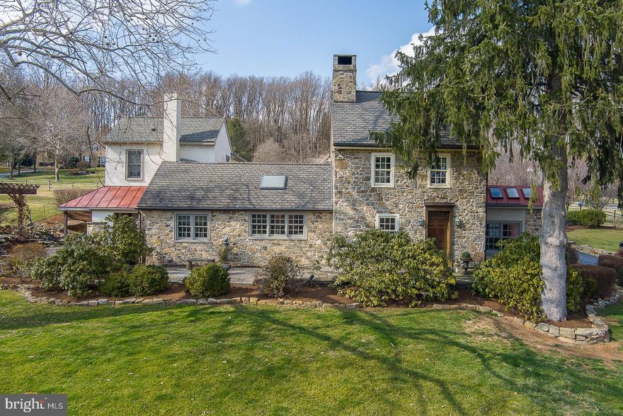 A horse lovers paradise, 2 Fox Run Road is 4.4+ acres of idyllic pastures situated on a private cul-de-sac in desirable Chester Springs.  Just feet from the property, horse trails beckon and connect to miles of beautiful woodlands and meadows stretching to the Horseshoe Trail, charming Birchrunville, and the surrounding countryside!  The large barn offers 6 birthing stalls and tack room at ground level, 5 stalls down below, and multiple haylofts and large open space to store tractors and cars.  The West Vincent Township park is steps from the yard, and all of this just off PA 401 with easy access to Route 202 and Turnpike.  Step back in time into the 1700's farmhouse that can be traced back to the William Penn Land Grant, meticulously restored over the last 20 years.  A two-story addition was added and created an open floor plan with an expansive Great Room on the main level and two bedrooms and bath above with laundry chute.  Those two bedrooms can also be easily converted to one large primary if so desired, and with outside access and separate staircase creates option for multi-generational living. The Farmhouse has been lovingly restored, inside and out, with exposed stone walls, original and custom hardwood flooring, and several rooms with radiant heated floors.  Additional eye-catching features include custom solid wood doors finished with original hardware, curved walls, deep window sills, reclaimed wood beams, and numerous custom built-ins and remodeled closets providing plenty of storage space, to name just a few!  The remodeled kitchen has custom beams and cherry cabinetry, honed marble counter tops, 2 custom deep sinks, Paramount faucets, Kitchen Aid double ovens that include a built-in convection microwave, and a slow cooker warming drawer. There is also a Kitchen Aid Gas cooktop with motion activated exhaust hood, Bosch dishwasher, Integrated 700-2 Sub Zero Refrigerator with custom wood panels, Marvel Luxury series beverage and wine refrigerator, and Velux programmable skylights.  The home offers a Library, Sun Room, Keeping Room, Kitchen, Great Room, Bed Room or office, Laundry (with pocket door) and half-bath on the main floor.  On the second floors, a Master Bedroom with on-suite, 2nd Bed Room and bath in the Farmhouse, with 2 more Bedrooms and full-bath in the addition.  The third floor of the Farmhouse is a Bedroom presently used as an office.  There are 4 wood burning fireplaces T/O and a Lopi wood stove in the kitchen, giving this home plenty of places to curl up with a good book.  An additional 500+ sf of finished basement provides a game room and separate gym area with plenty of space for exercise equipment.  The patio doors off the kitchen and Great Room allow for entertaining and sweeping views of the bucolic gardens, landscaping, and custom waterfall with koi pond.  The salt water heated pool, outdoor shower, numerous patios, gazebo and firepit areas are complete with a custom tiki bar that provides a perfect place to entertain and extend your living area outside to enjoy the gorgeous views.  A whole house Generac Generator and 1000 gallon propane tank (owner owned) ensures you will never be without power, and your dogs can roam worry-free due to the invisible fence.