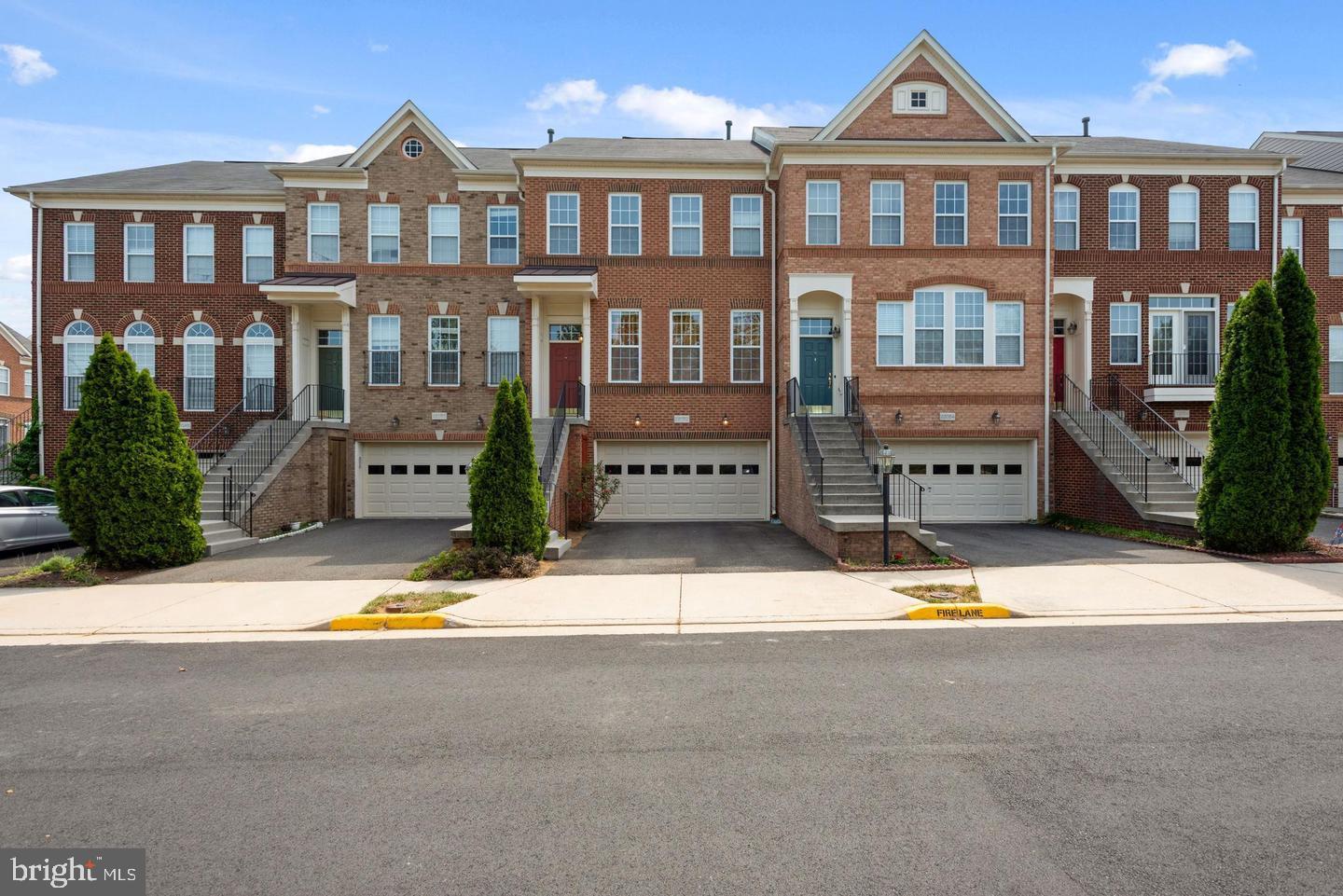 AVAILABLE September 1st | Stunning Brick-Front Townhome in Broadlands!
Welcome home to this beautifully maintained 3-level, 3-bedroom, 3.5-bath Van Metre townhome with an oversized 2-car garage, located in the highly desirable Broadlands community. Bright, spacious, and filled with natural light, this home offers luxury living with thoughtful upgrades throughout.
Step through the inviting foyer into an elegant main level featuring gleaming hardwood floors, a formal living and dining area, a powder room, and coat closet—all perfect for hosting or relaxing in style. The layout flows effortlessly into a large family room off the kitchen, ideal for both everyday living and entertaining.
The gourmet kitchen boasts granite countertops, gas cooktop, wall oven and microwave, abundant cabinetry, and a spacious prep island. A sunny breakfast nook leads to a large private deck, perfect for outdoor dining or winding down in the evenings.
Upper Level Features: Luxurious primary suite features tray ceilings, a generous walk-in closet, and a spa-like bath with soaking tub, standing shower, and dual vanities. Two additional bedrooms offer vaulted ceilings and custom closets. Laundry is conveniently located on this level with washer and dryer for your convenience.
The walk-out lower level includes a large rec room, half bath, extra storage, and access to a fully fenced backyard—great for entertaining or relaxing in privacy.
Located in the top-rated Loudoun County School District (Mill Run ES, Eagle Ridge MS, Briar Woods HS), and just minutes to the Silver Line Metro, Brambleton Town Center, Dulles Airport, and major shopping and dining. Repair Deductible $85. Enjoy resort-style community amenities: pools, tennis courts, tot lots, scenic trails, lakes, and more.
Don’t miss this amazing opportunity—schedule your tour today !