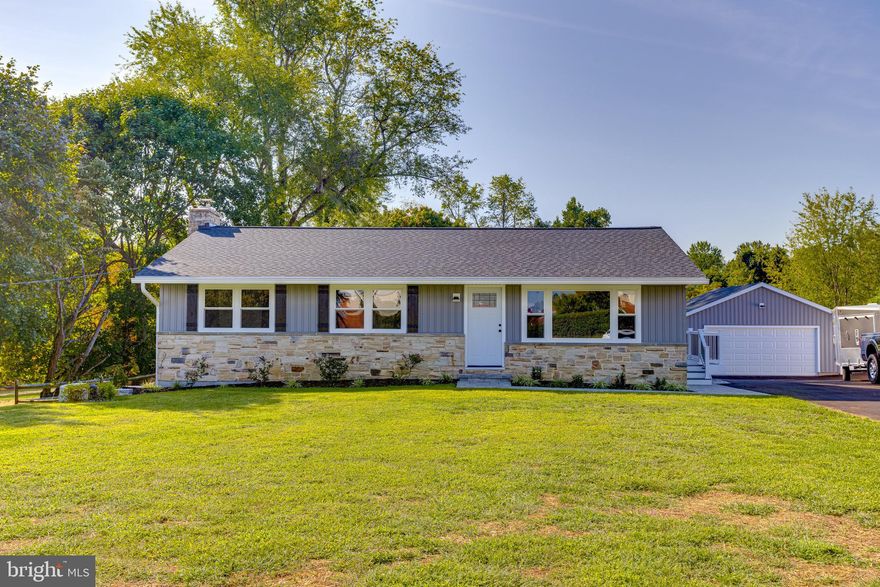Gorgeous fully remodeled Fallston rancher with 4 beds, and 3 full baths and oversized detached garage.  Huge deep yard, brand new deck, fully finished basement with walkout, fireplace and bar.
Everything in this home is completely new and remodeled. Kitchen is completely new and modern with custom cabinetry, granite, backsplash, and stainless appliances, with a massive granite built in table.  Three bedrooms and a full bath are on the main floor hallway including an owners suite with its own private full bath.  The basement houses a massive living room area with fireplace and bar, storage, laundry, a fourth bedroom with its own full bath, and has a walkout into the backyard.
A beautiful brand new composite deck spans the rear of the home with a walk down to the driveway, and overlooks the entire cleared almost acre of property behind the home.  There is also a massive newly constructed oversized detached garage with a second level of storage above at the end of the garage.  this house has it all, is just minutes from Bel Air and is located in Fallston School district.  Everything is new, pristine and move in ready, and waiting for you!