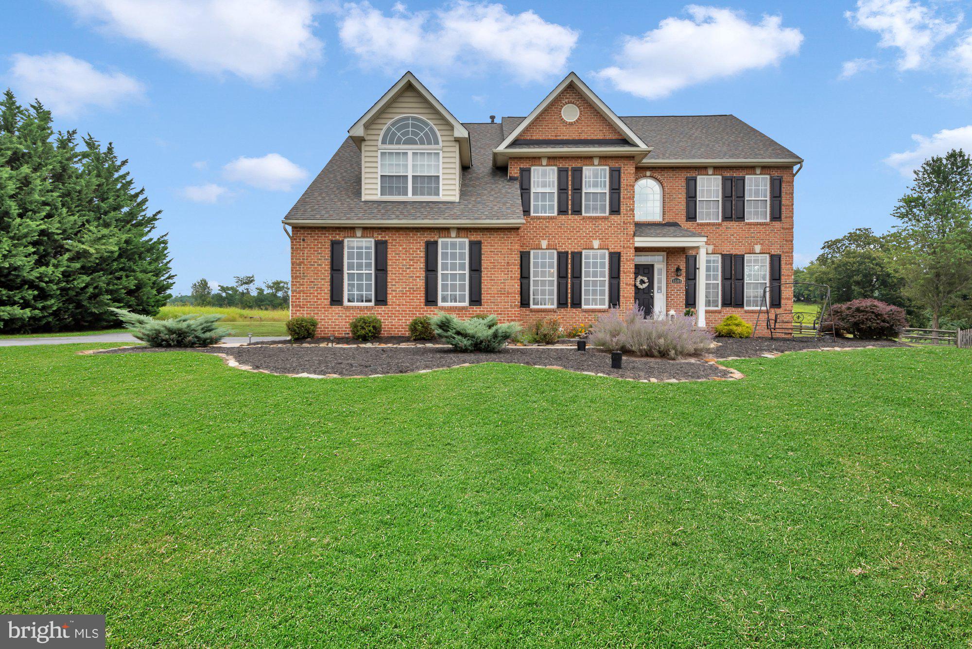 Welcome to 8504 Doubletree Court—an elegant, all-brick Colonial set on nearly an acre in one of Frederick’s most prestigious enclaves. Perfectly positioned on a quiet cul-de-sac and zoned for the coveted Oakdale schools, this distinguished home blends grand architectural presence with thoughtful modern upgrades— turn-key and ready for the next discerning owner.
Step inside to a soaring two-story foyer flanked by formal entertaining spaces, a private home office, and a showstopping two-story great room with cathedral ceilings and gas fireplace. The gourmet kitchen features cherry cabinetry, ceramic tile floors, and a sun-filled morning room that opens to a 1,100+ sq ft composite deck—a true outdoor living experience.
Upstairs, retreat to an expansive primary suite with sitting area, tray ceiling, walk-in closet, and spa-inspired bath complete with heated floors and a frameless glass shower. Three additional bedrooms offer generous space and light. The fully finished walkout lower level features a second family room with fireplace, a flex space for gym or theater, full bath, and a 5th bedroom or executive-style office.
Professionally landscaped grounds, a 3-car garage, and refined curb appeal complete the package. All just minutes from commuter routes, shopping, and downtown Frederick. Don’t miss this timeless Brick Estate in Oakdale—Over 6,000 total Sq Ft of Refined Living provides luxury, space, and location— all perfectly aligned. Welcome home!